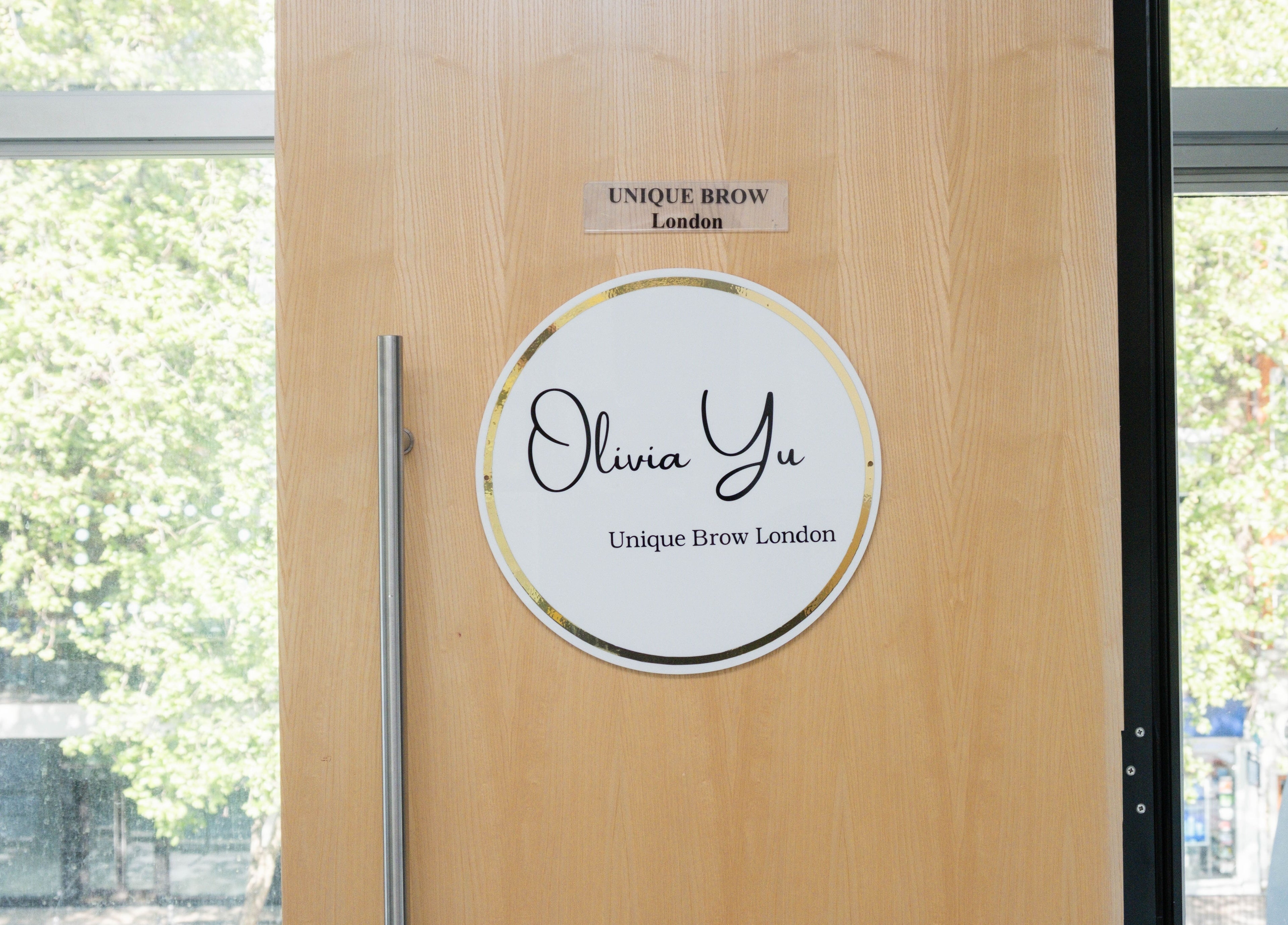 Entrance door sign at Unique Brow London in London, England, GB, showcasing a chic and modern design.