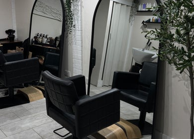 Chic styling chairs and mirrors at Coloured by Madison, Plymouth, England, GB, showcasing modern salon design.