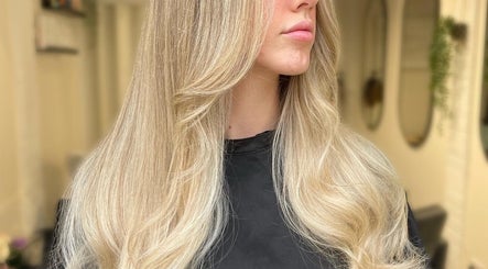 Blonde hair styled at Coloured by Madison in Plymouth, England, GB, showcasing smooth, flowing locks.