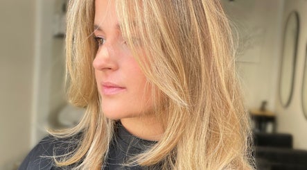 Close-up of woman with blonde hair styled at Coloured by Madison, Plymouth, England, GB.