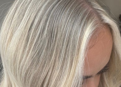 Silky blonde hair styled at Coloured by Madison in Plymouth, England, GB, showcasing vibrant health and shine.