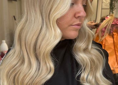 Blonde waves styled at Coloured by Madison in Plymouth, England, GB showcasing expert hair coloring.