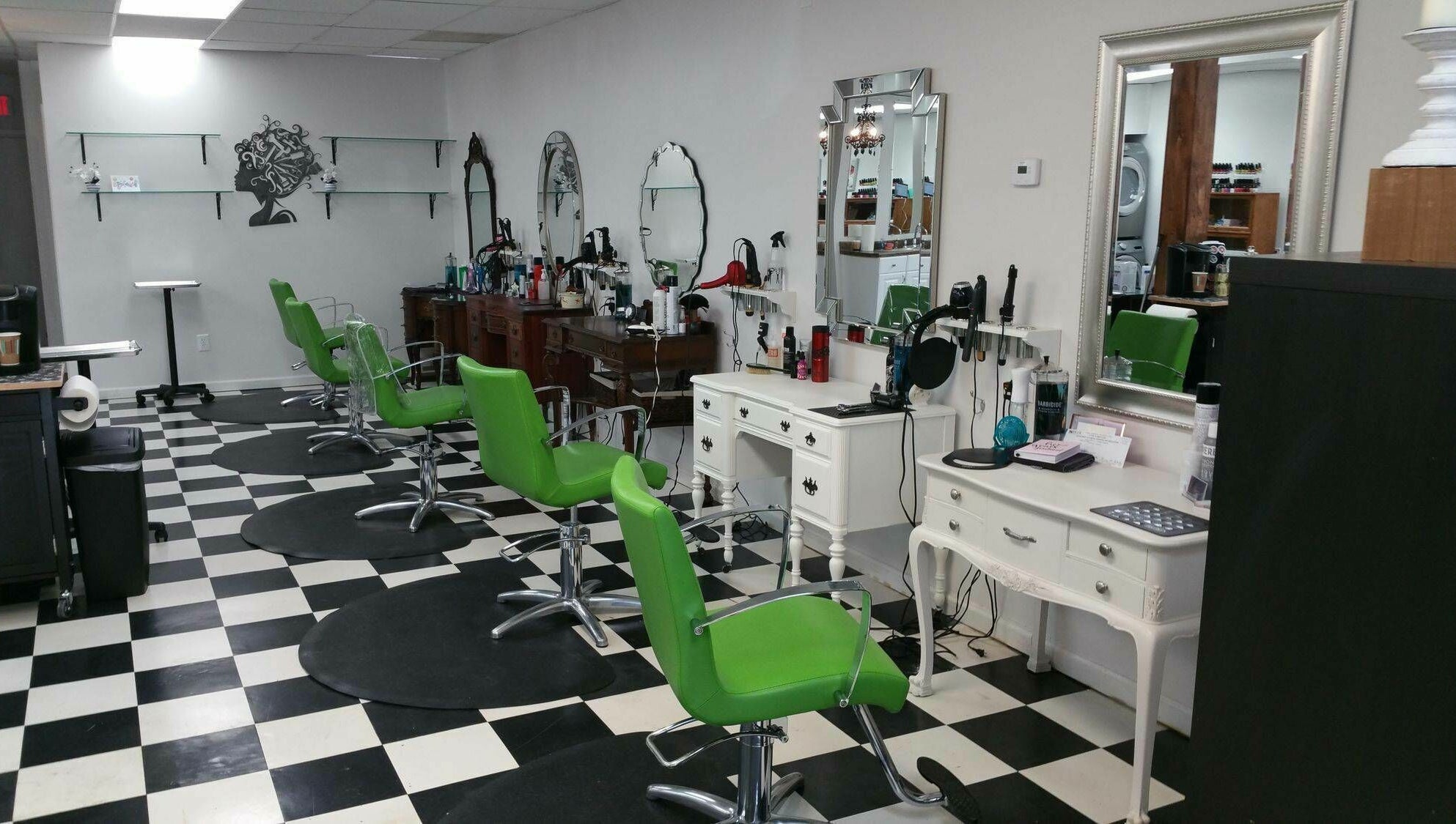 Bright green chairs at All About Hair salon in Lewes, Delaware, US. Sleek styling station with mirrors.