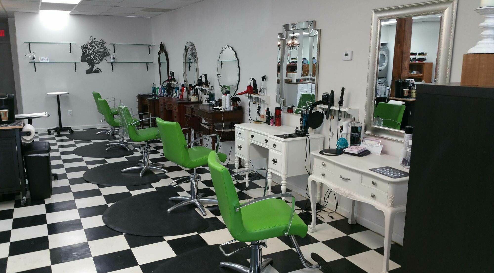 Bright green chairs at All About Hair salon in Lewes, Delaware, US. Sleek styling station with mirrors.