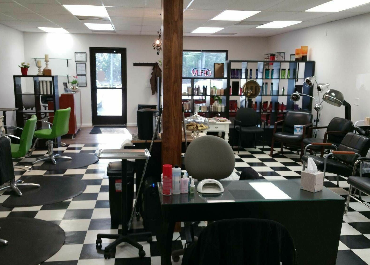Chic interior of All About Hair salon in Lewes, Delaware, US featuring vibrant chairs and modern decor.