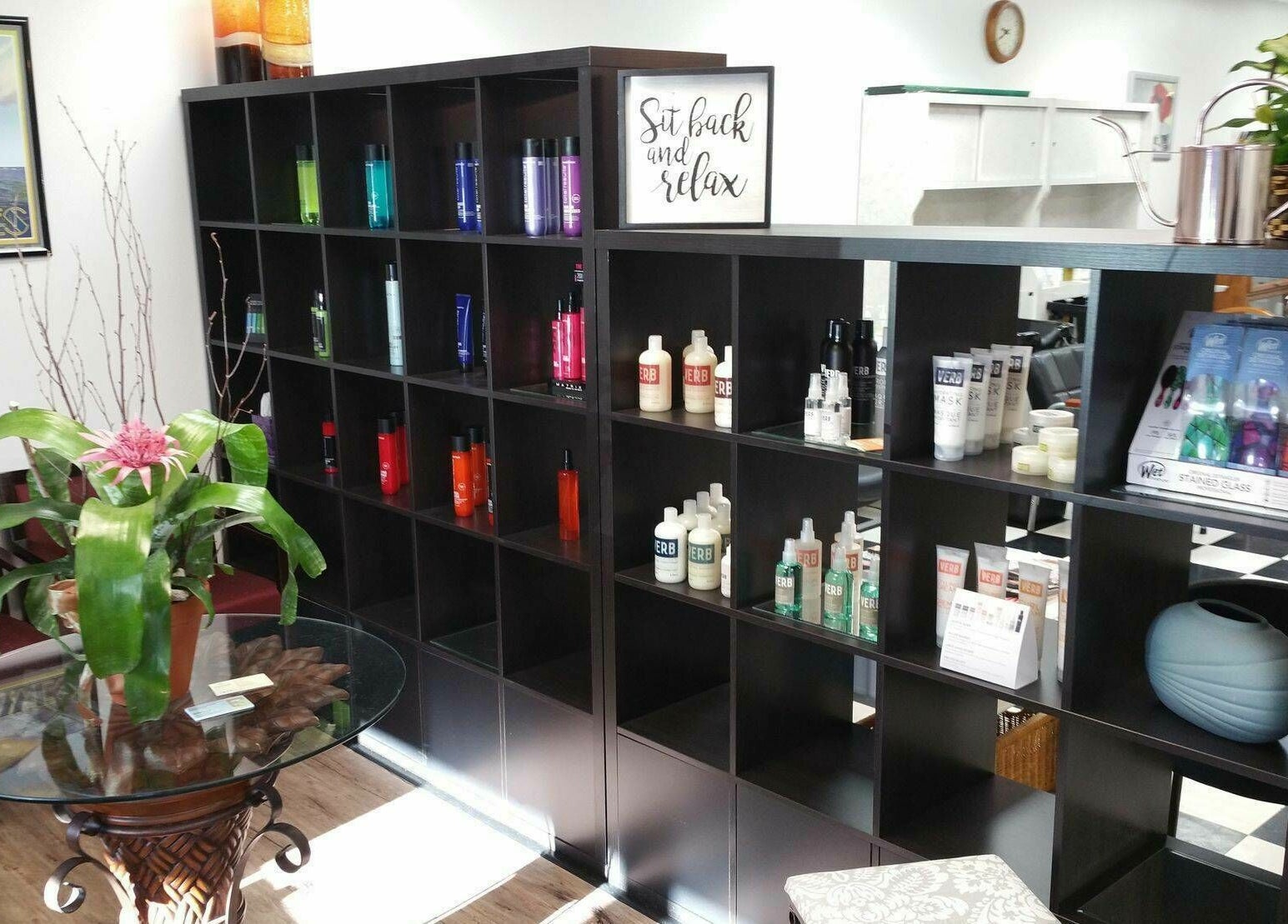 Shelves with hair products at All About Hair, Lewes, Delaware, US, offering a relaxing atmosphere.
