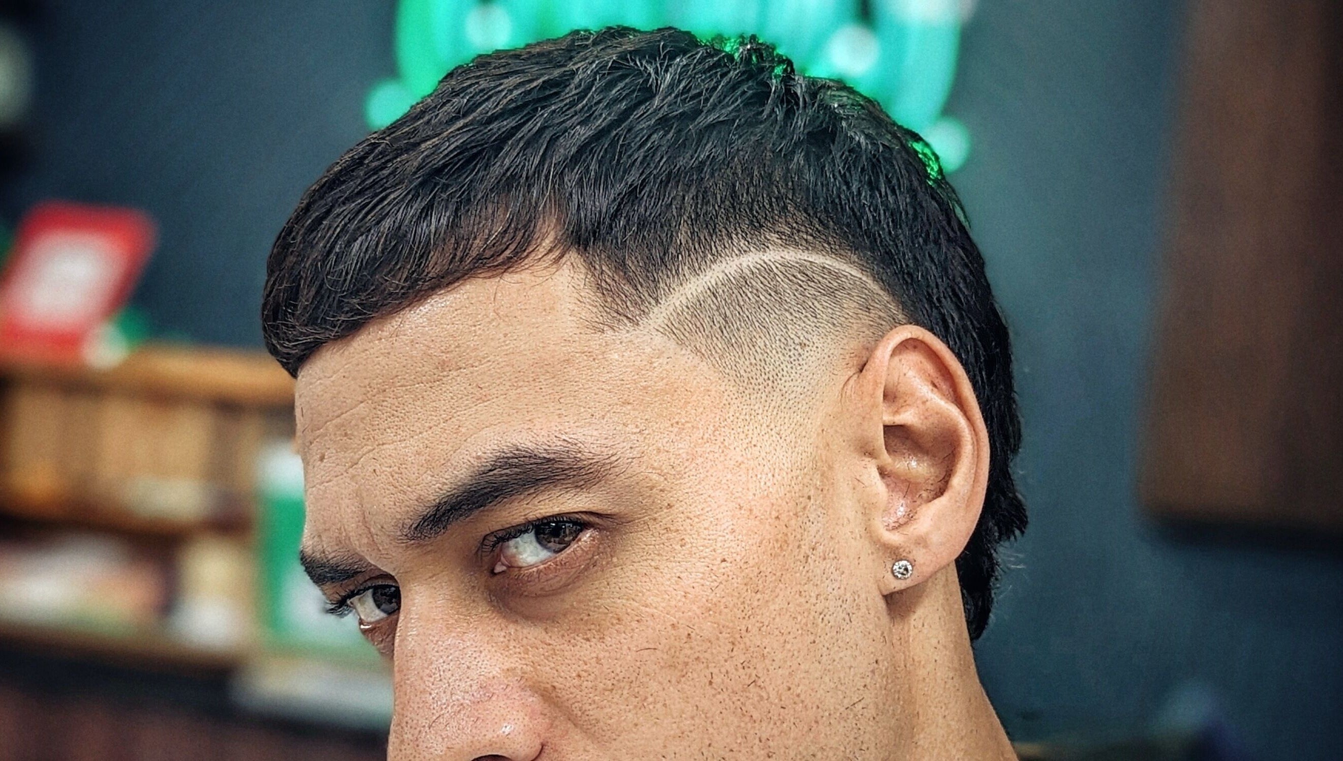 Close-up of a stylish haircut at Barber Zeph, Hong Kong Island, HK, featuring a precise design.