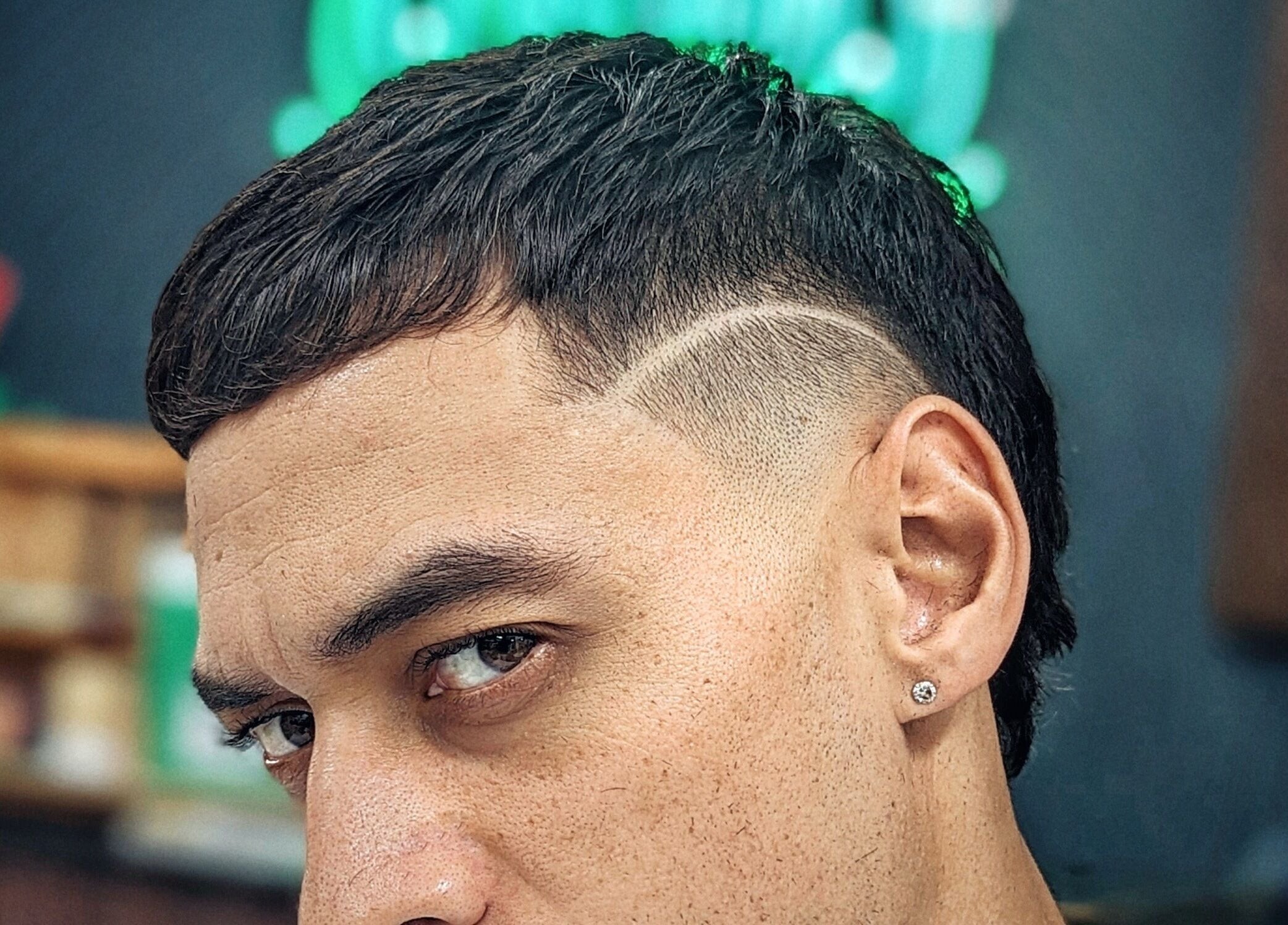 Close-up of a stylish haircut at Barber Zeph, Hong Kong Island, HK, featuring a precise design.