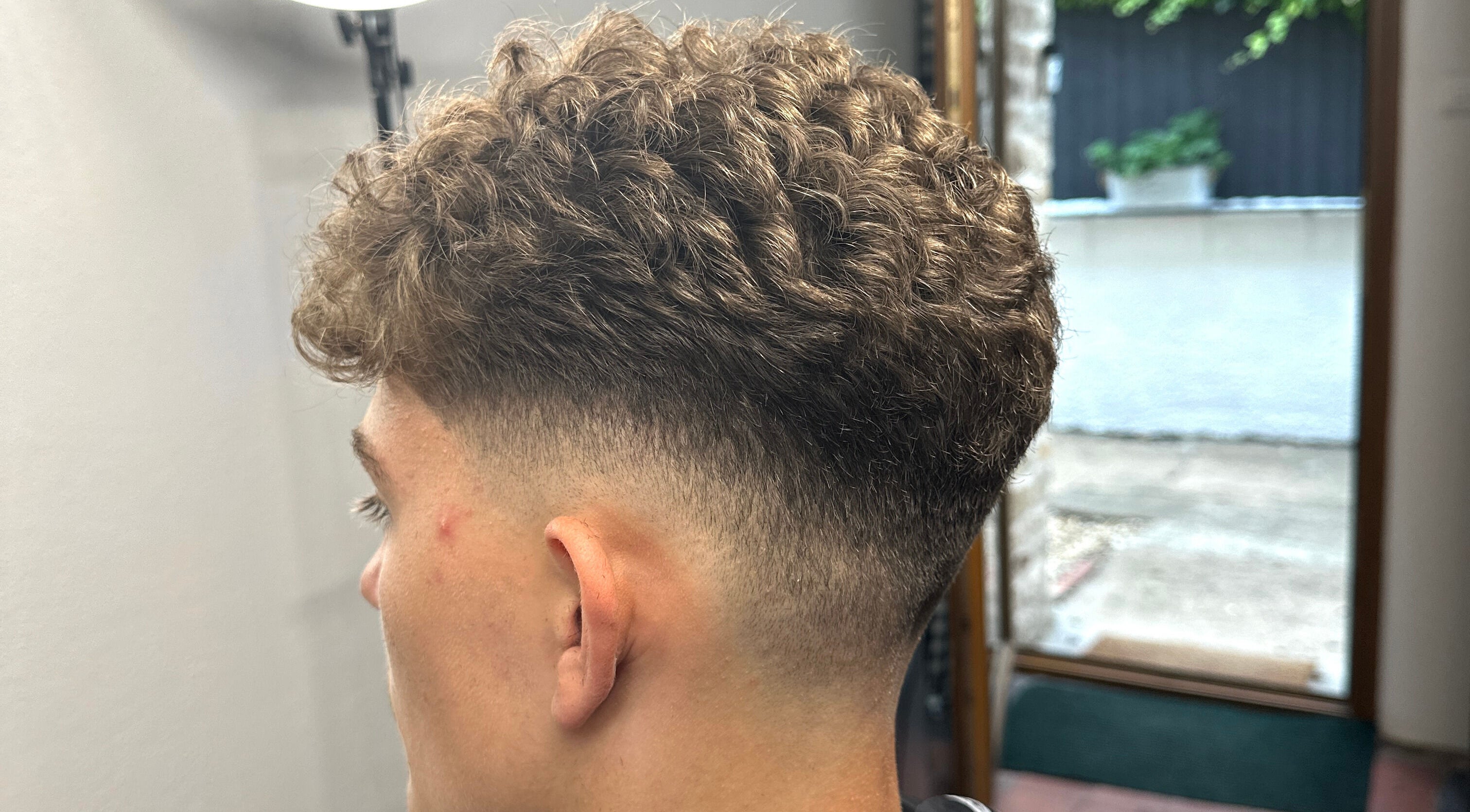 Crisp fade hairstyle expertly crafted at RGJ Barbers, Washingborough, England, GB.