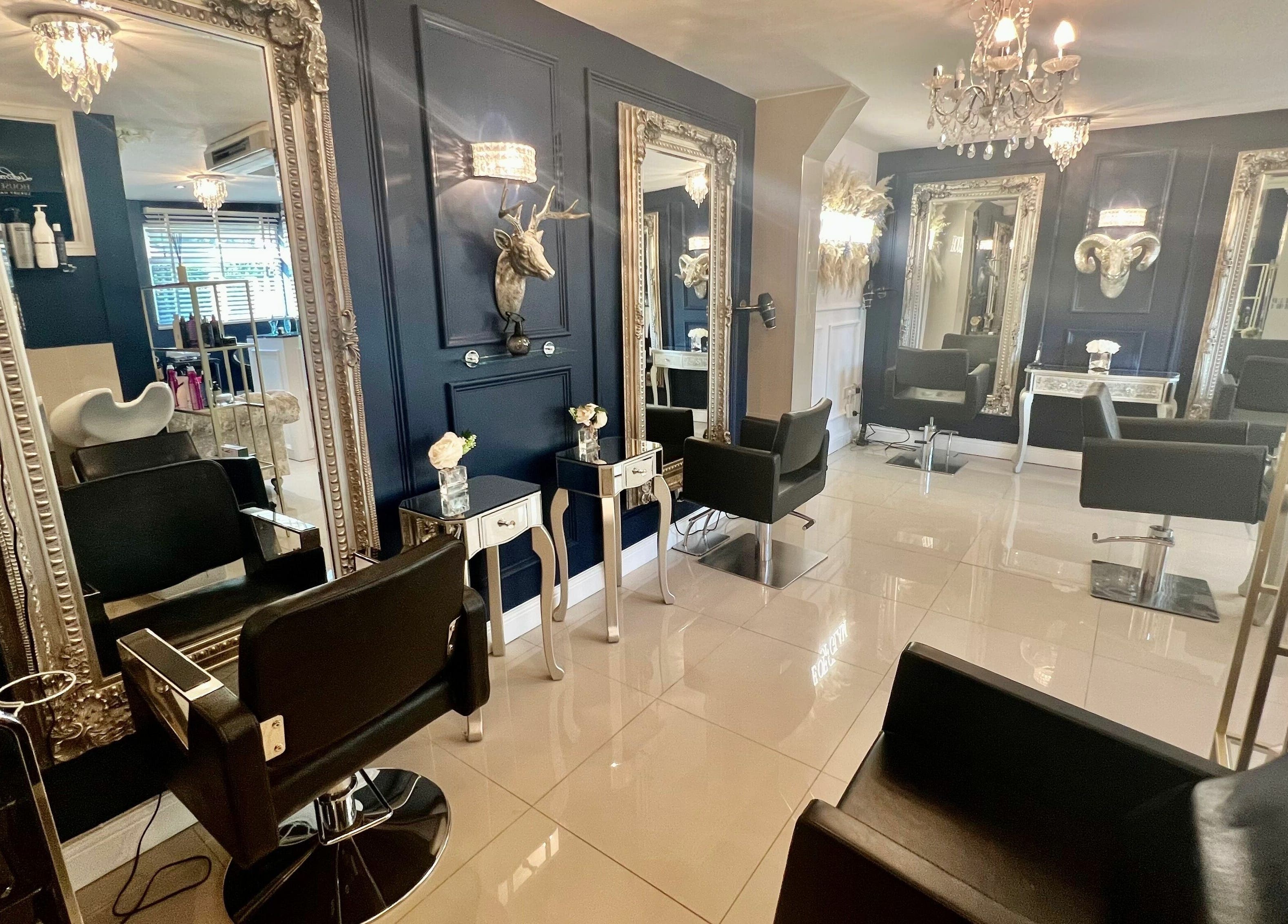 Sophisticated interior of Ludicrous Lengths salon, Thornbury, England, GB with chic mirrors and modern decor.