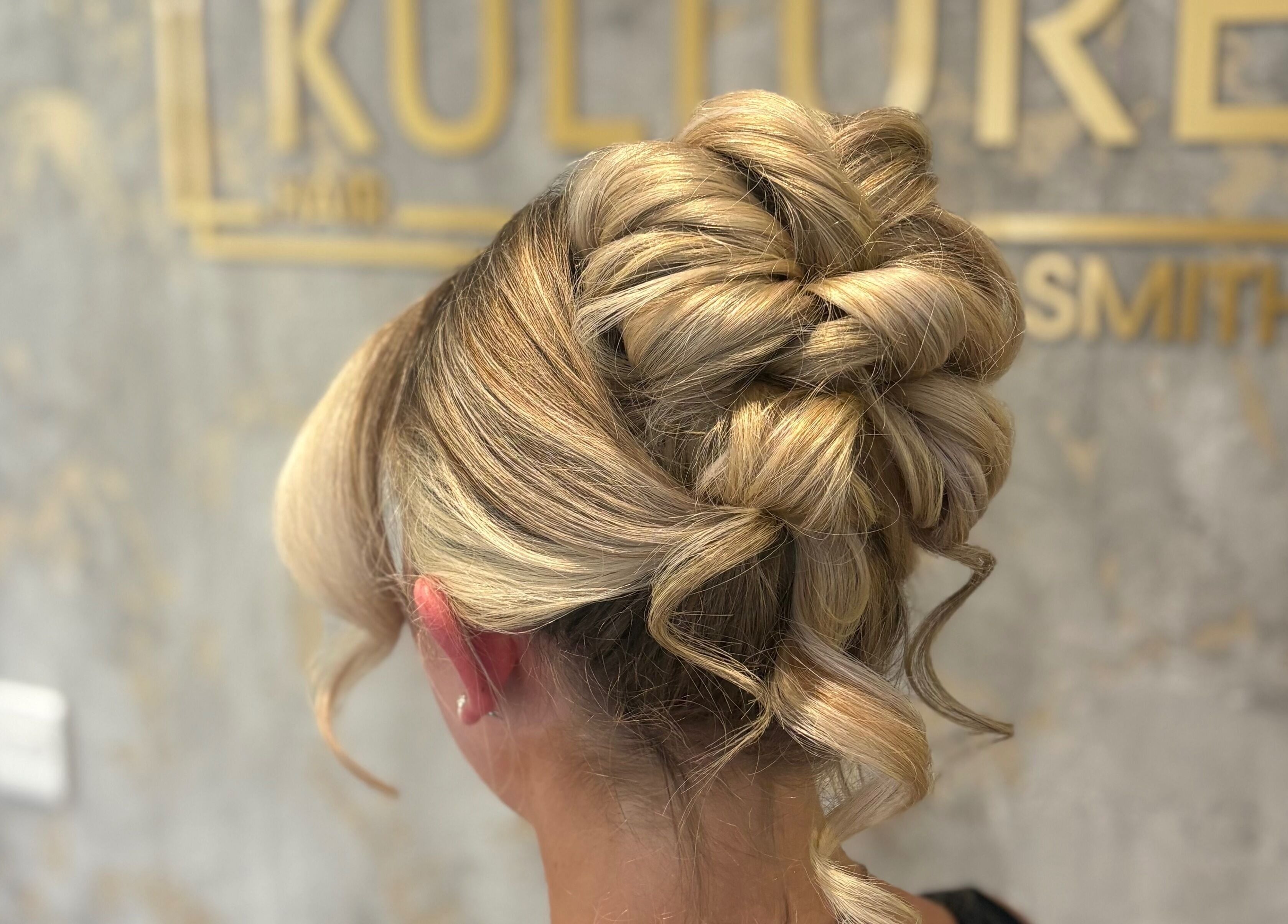 Stunning braided updo at Hair by Olivia Bain, Kirkintilloch, Scotland, GB. Perfect for elegant occasions.