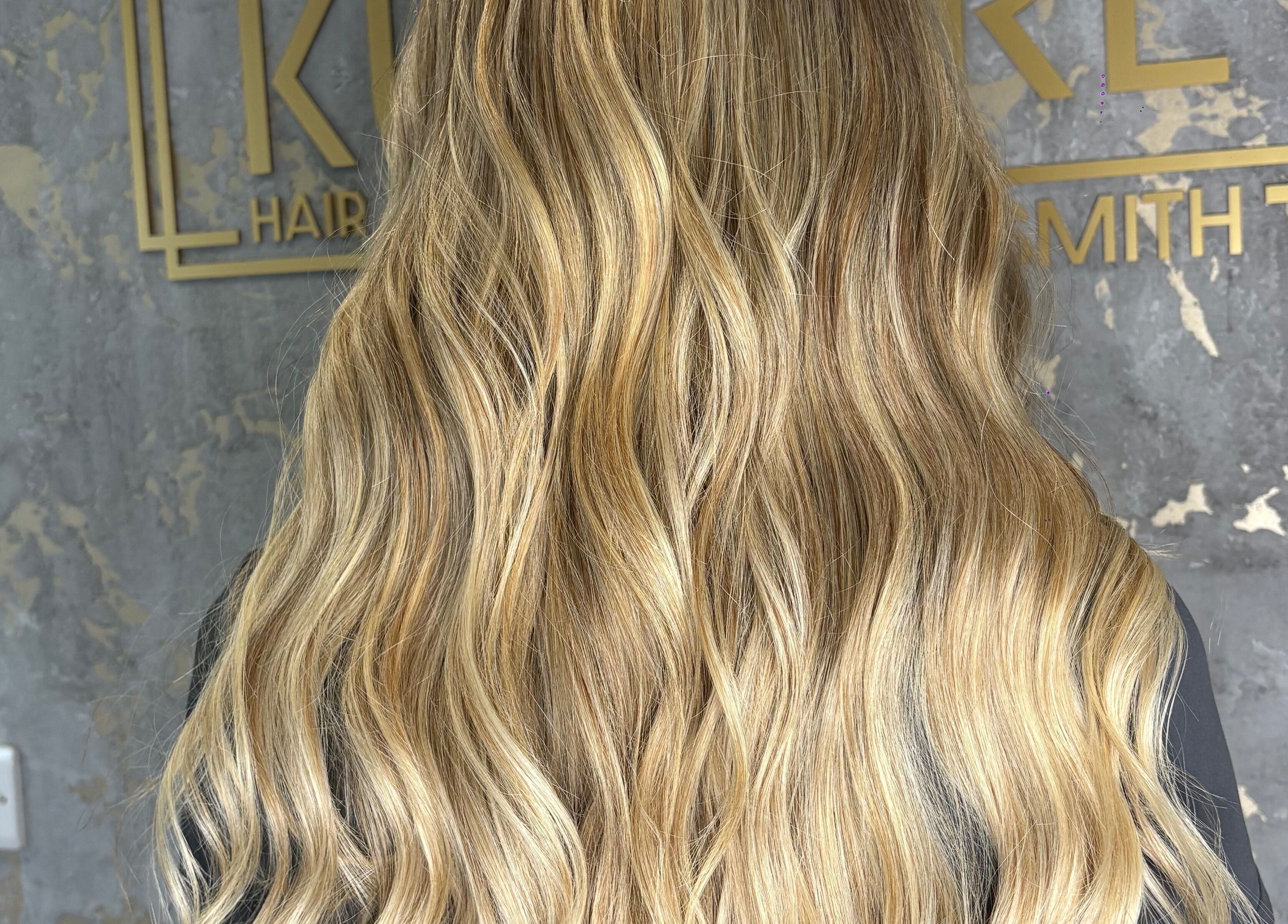 Blonde wavy hair styled at Hair by Olivia Bain, Kirkintilloch, Scotland, GB.
