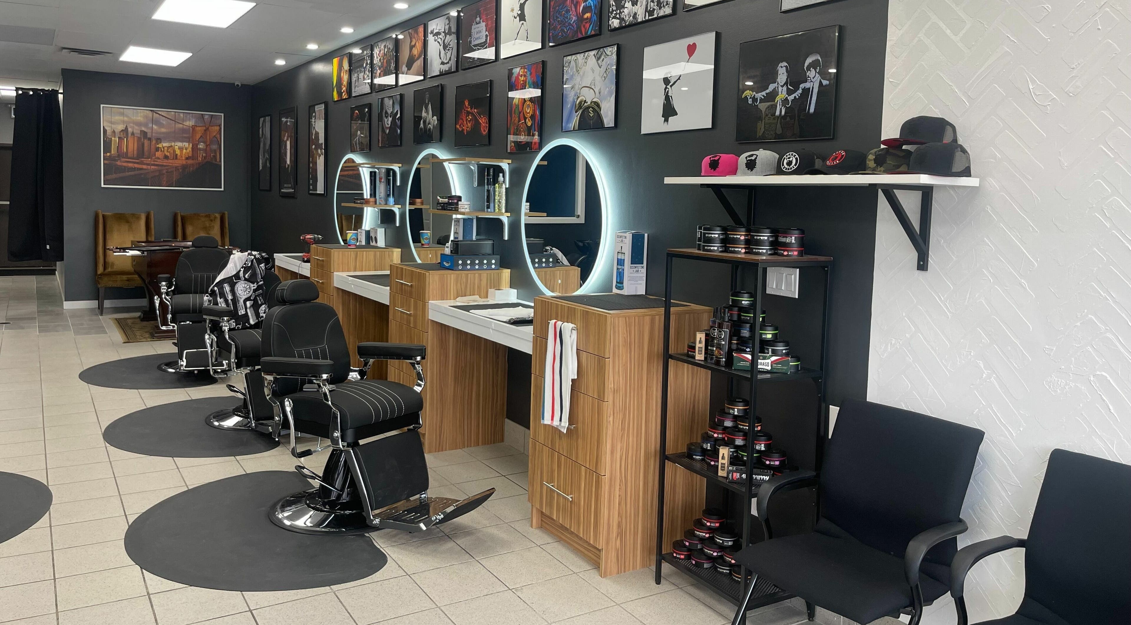 Modern interior of Legends Barbershop, Calgary, Alberta, CA with stylish chairs and illuminated mirrors.