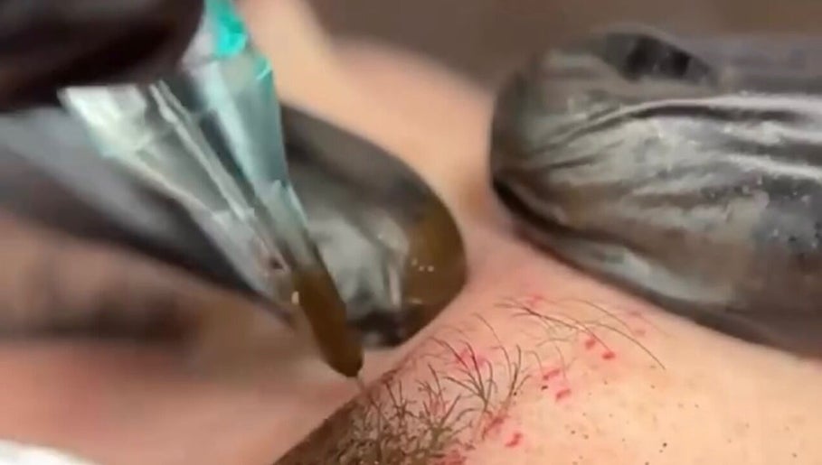 Close-up of microblading procedure at G’lamore Ink & Beauty, Birmingham, England, GB, showcasing expert technique.