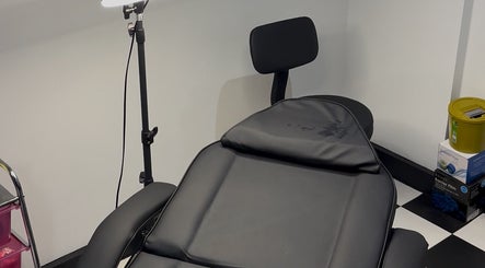Treatment chair at G’lamore Ink & Beauty, Birmingham, England, GB, ideal for relaxing beauty sessions.