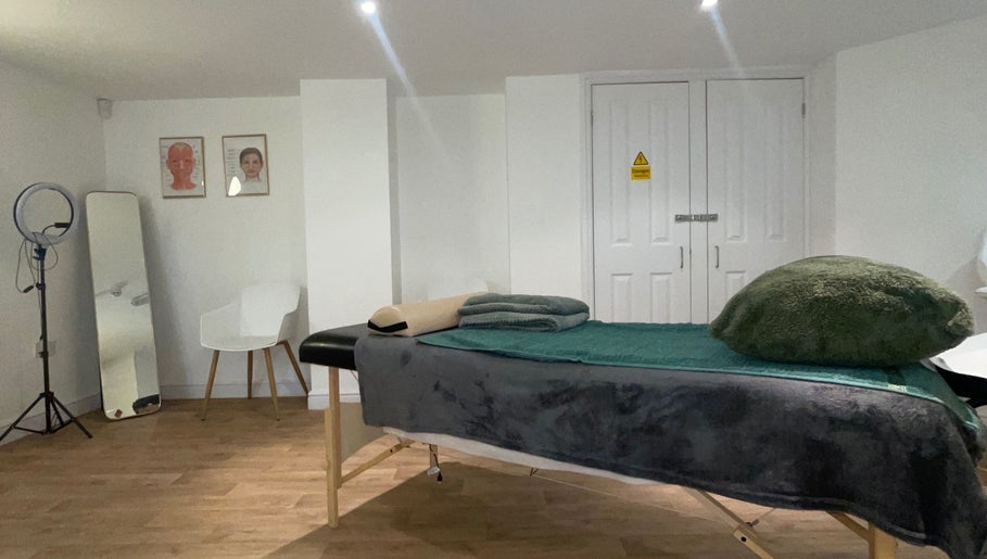 Spacious therapy room at Alikia Jade Physiotherapy in Doncaster, England, GB featuring a massage table and decor.