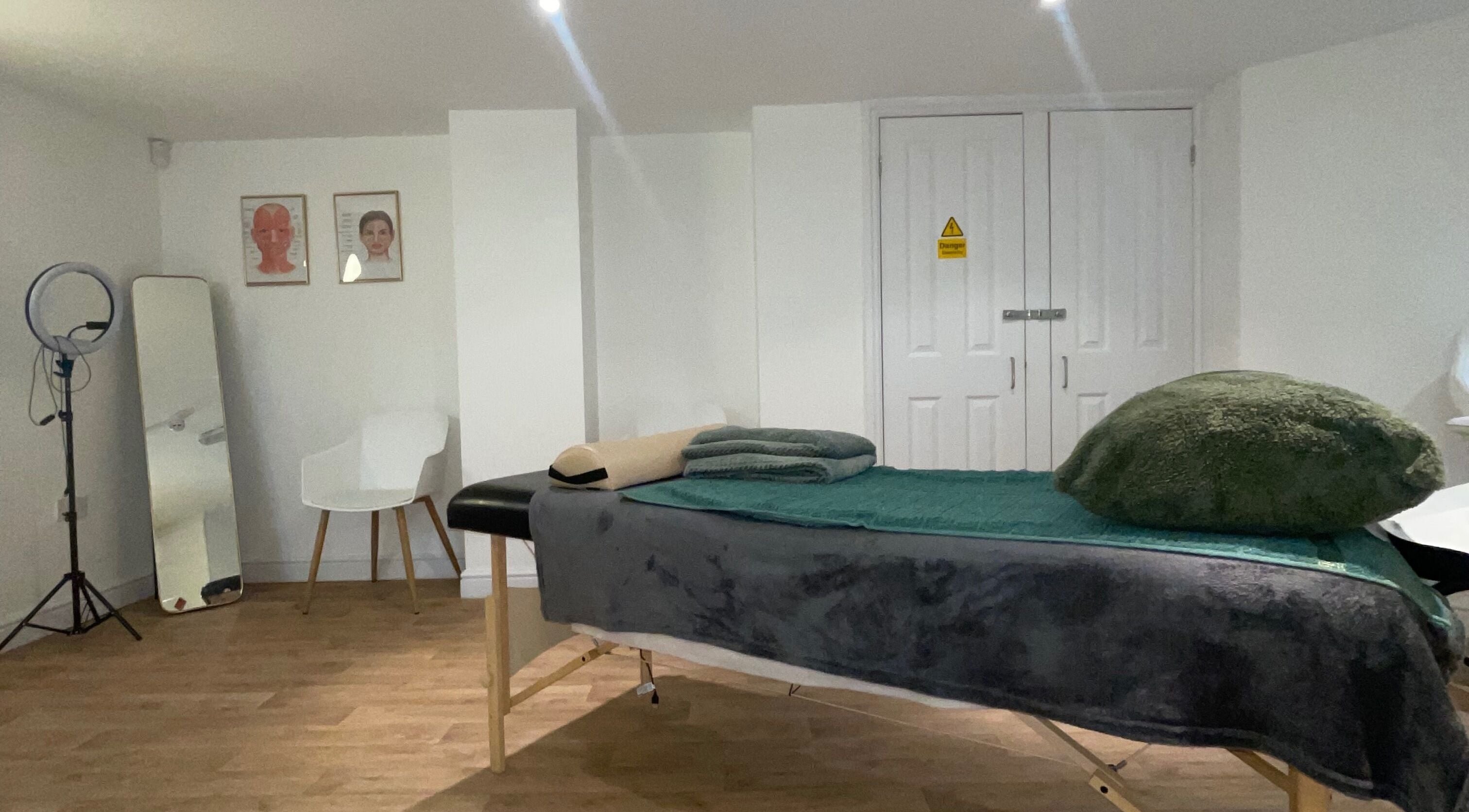 Spacious therapy room at Alikia Jade Physiotherapy in Doncaster, England, GB featuring a massage table and decor.
