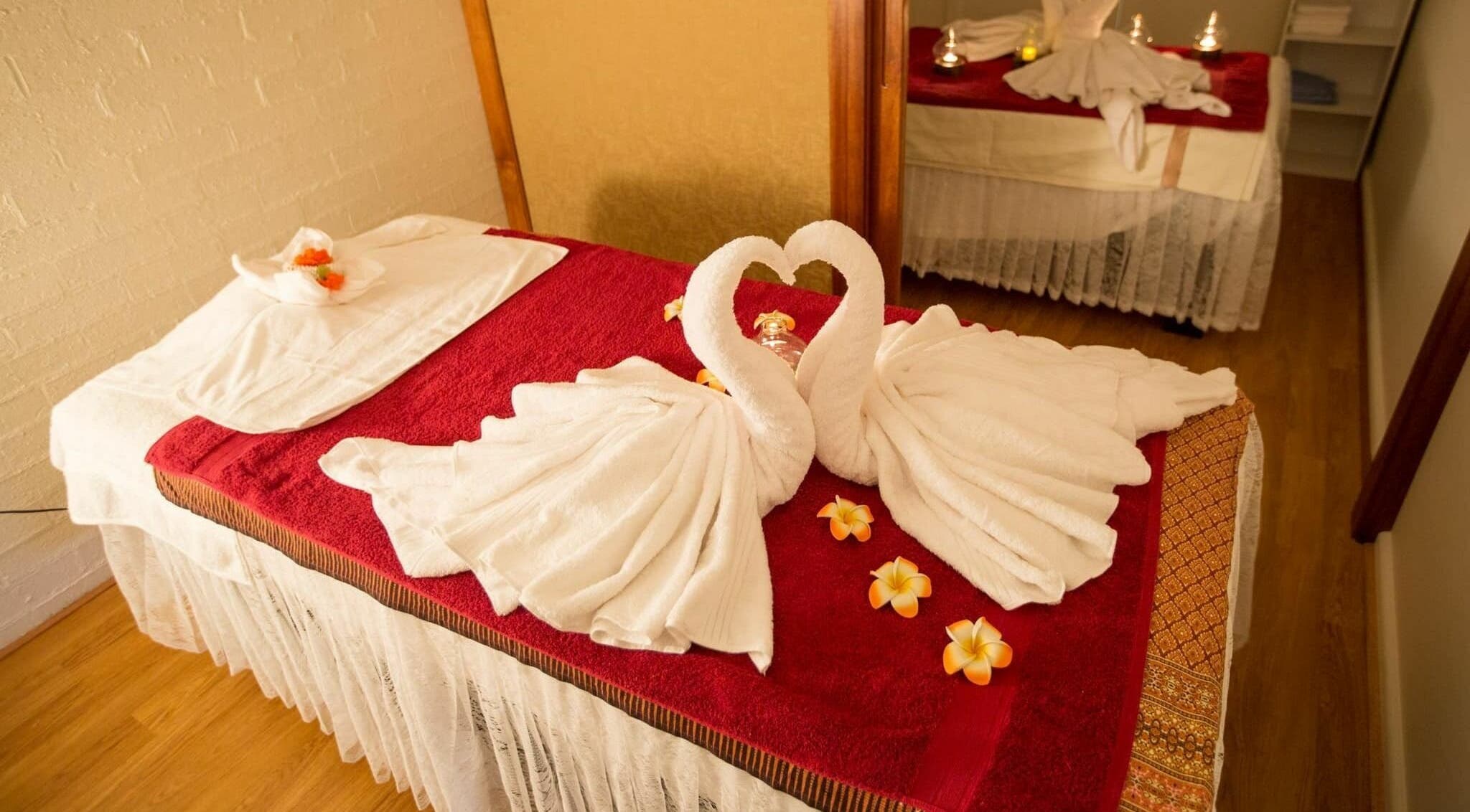 Elegant massage table with towel swans at Woonona beach massage in Woonona, New South Wales, AU.