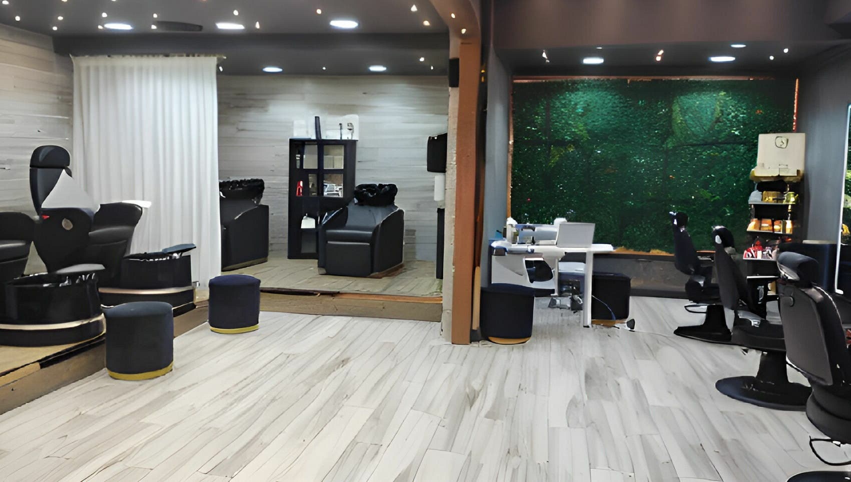 Chic interior of Fit Social salon in Dubai, Dubai, AE with modern chairs and lush greenery wall.