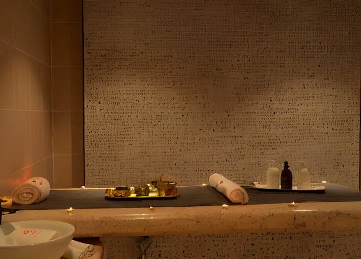 Relaxing massage room at Fit Social, Dubai, Dubai, AE with candles and soothing decor.