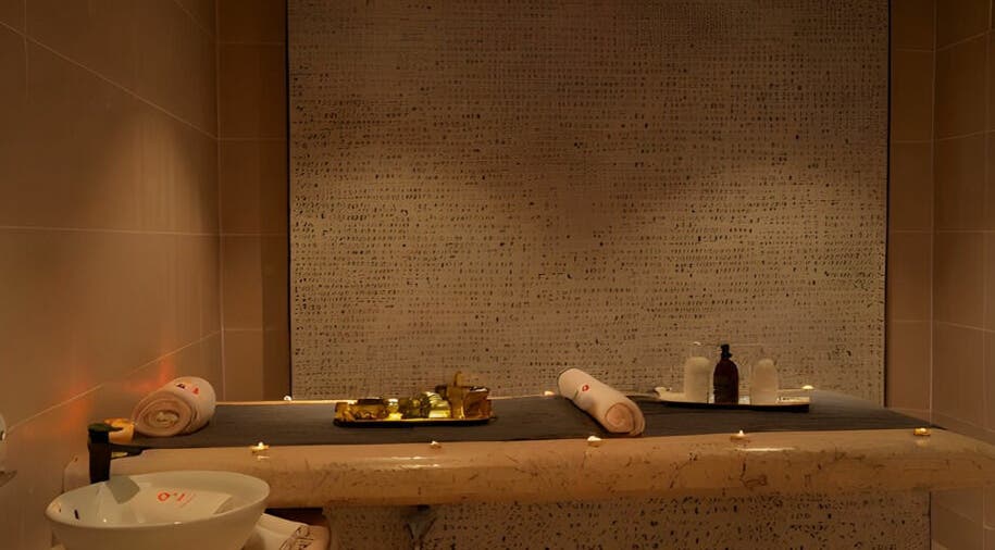 Relaxing massage room at Fit Social, Dubai, Dubai, AE with candles and soothing decor.