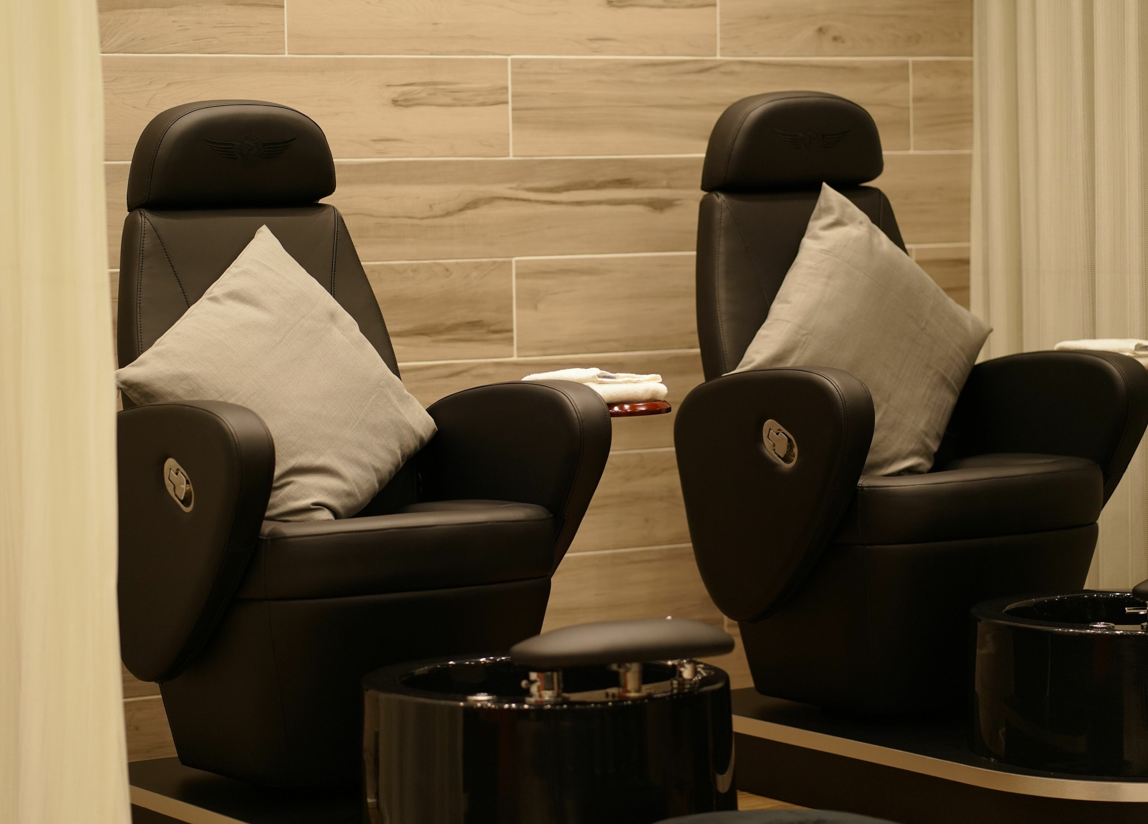 Luxury pedicure chairs at Fit Social, Dubai, Dubai, AE, offering a serene spa experience with modern design.