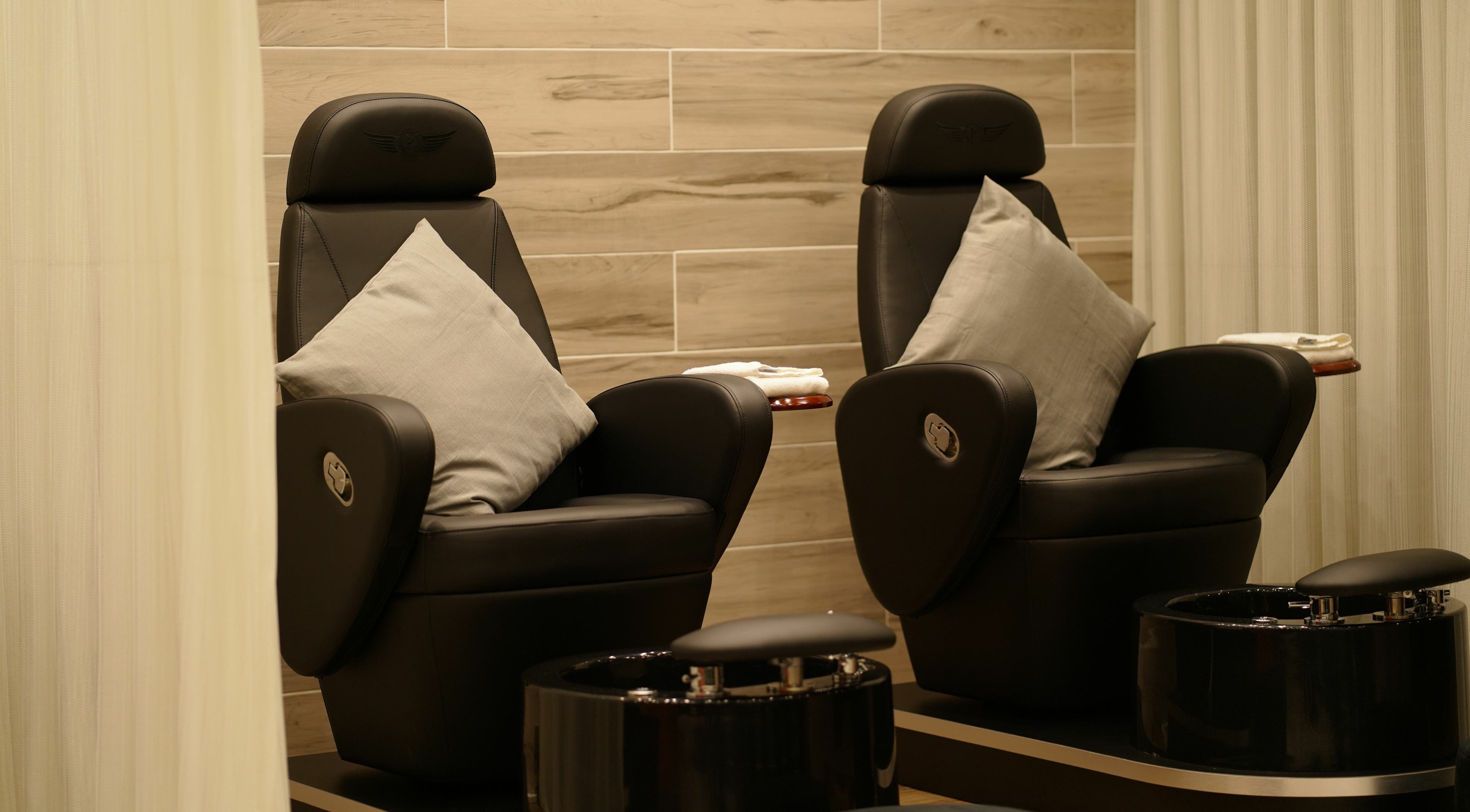 Luxury pedicure chairs at Fit Social, Dubai, Dubai, AE, offering a serene spa experience with modern design.