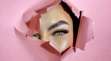Elegant eye with lash extension seen through ripped pink paper at Olivio George • Lash Designer • Extensão de Pestanas •, Lisboa.