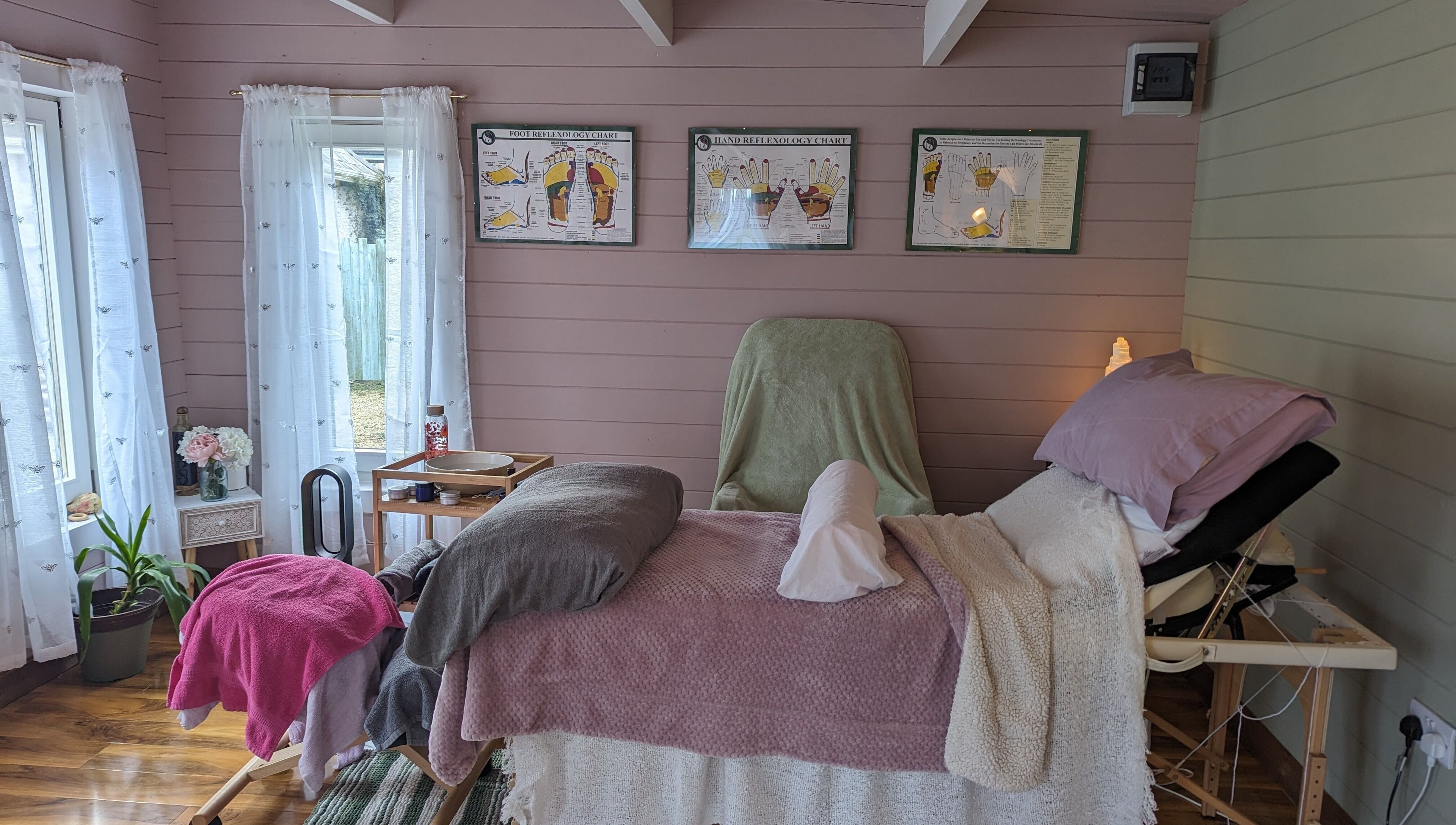 Cozy massage bed at Hawthorn Healing, Johnstownbridge, County Kildare, IE, in a tranquil setting.