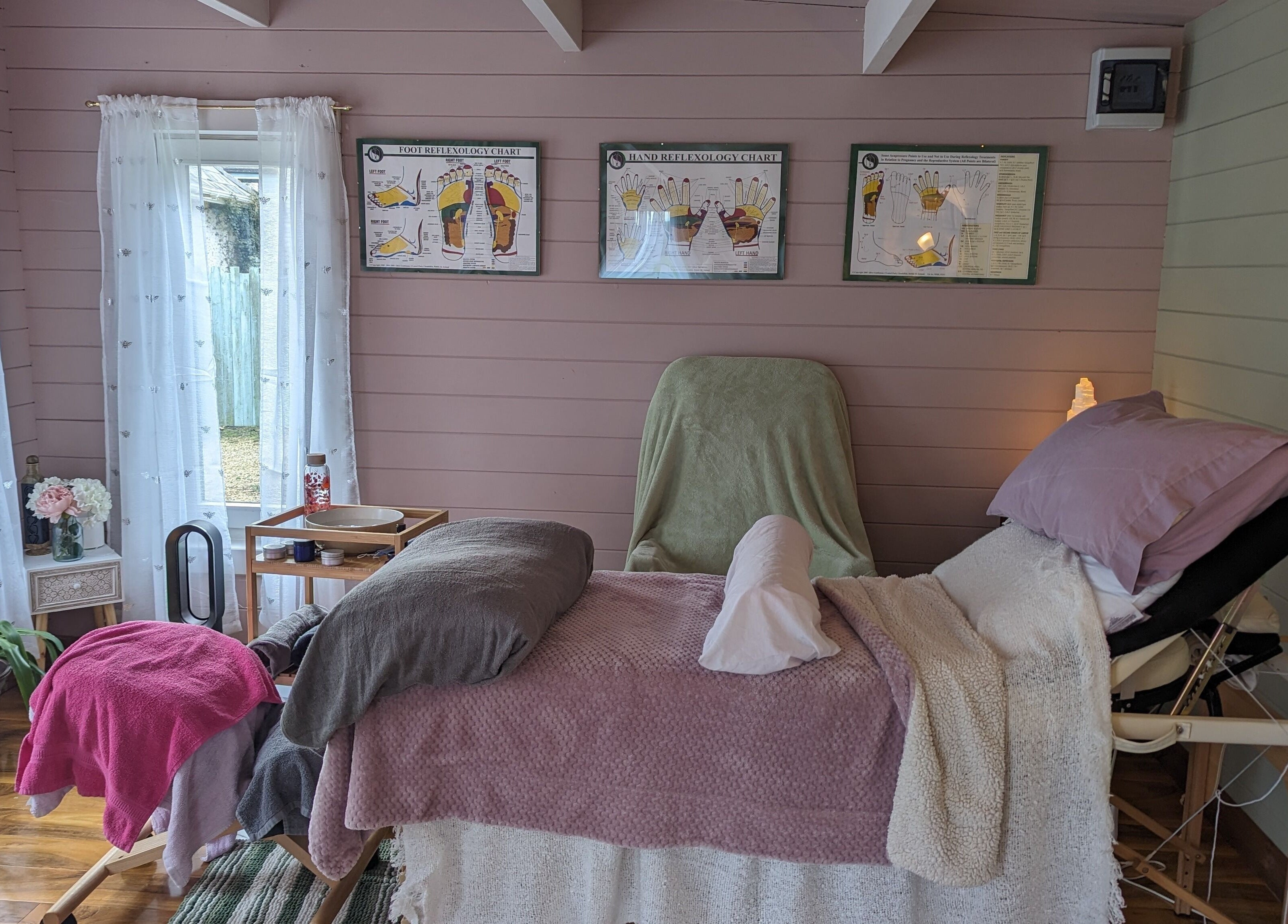 Cozy massage bed at Hawthorn Healing, Johnstownbridge, County Kildare, IE, in a tranquil setting.