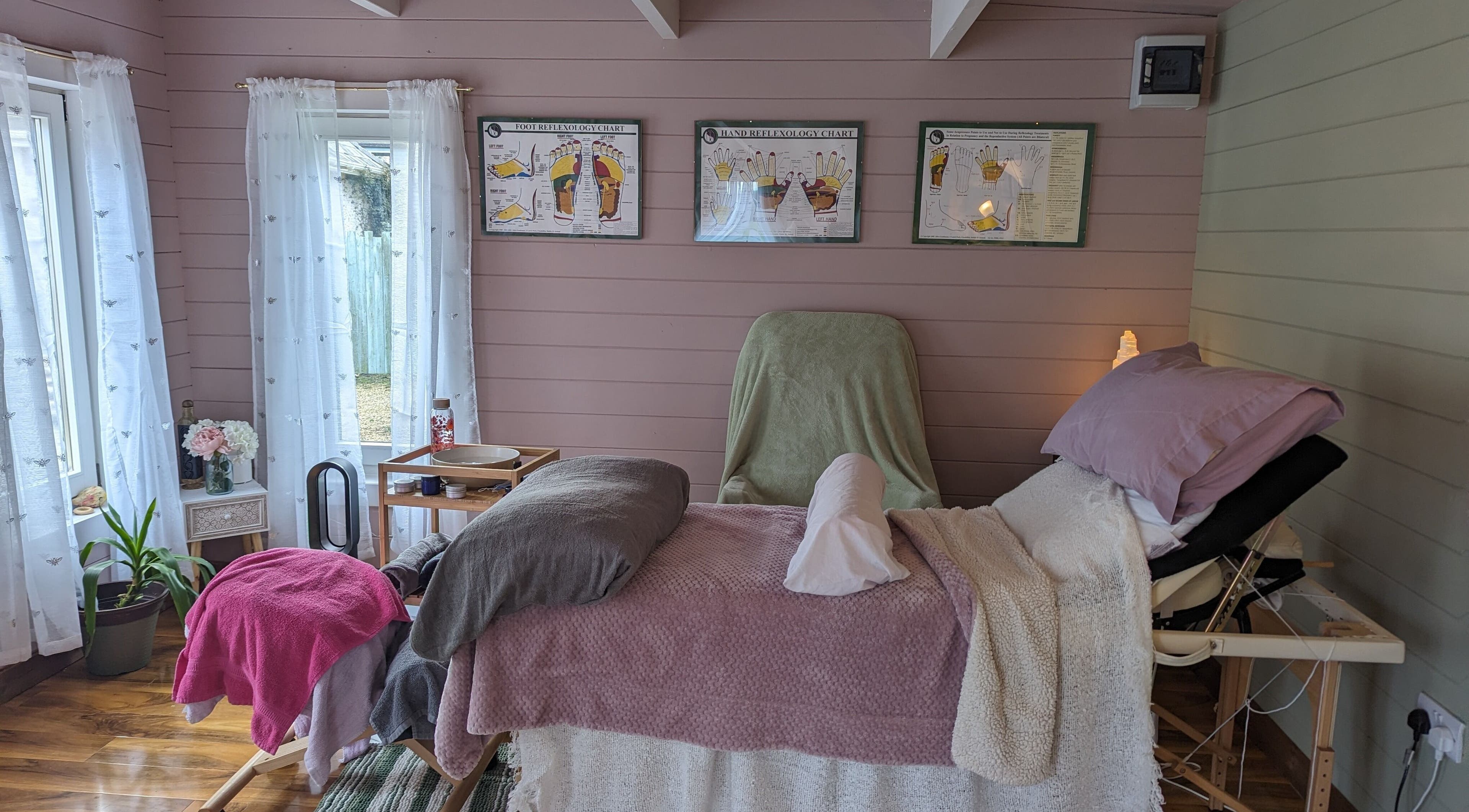 Cozy massage bed at Hawthorn Healing, Johnstownbridge, County Kildare, IE, in a tranquil setting.