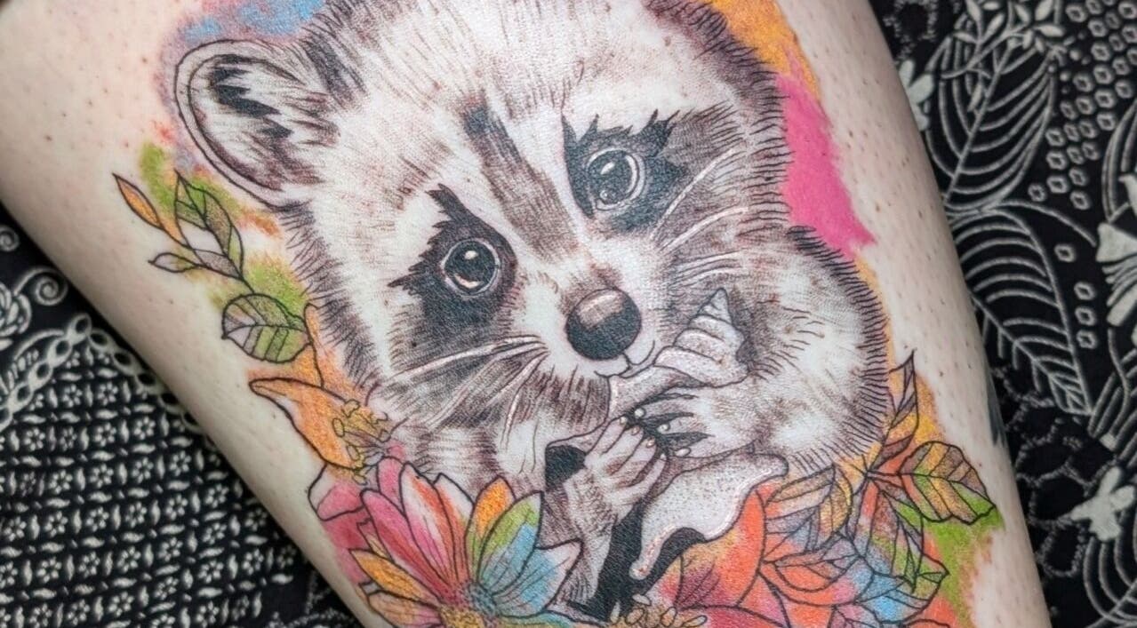 Detailed raccoon tattoo with colorful flowers at Sarah Welsh - Tattoo & Permanent Makeup, Dunfermline, Scotland, GB.