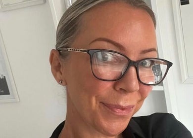 Friendly staff member at Baileys Beauty Boutique, Newport Pagnell, England, GB, ready to assist clients.