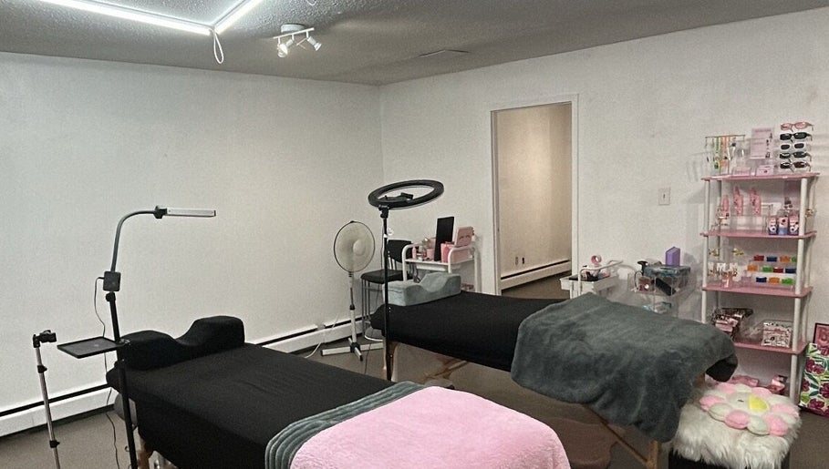 Relaxing treatment room at Lashes by Rina in Calgary, Alberta, CA, featuring professional spa beds and equipment.