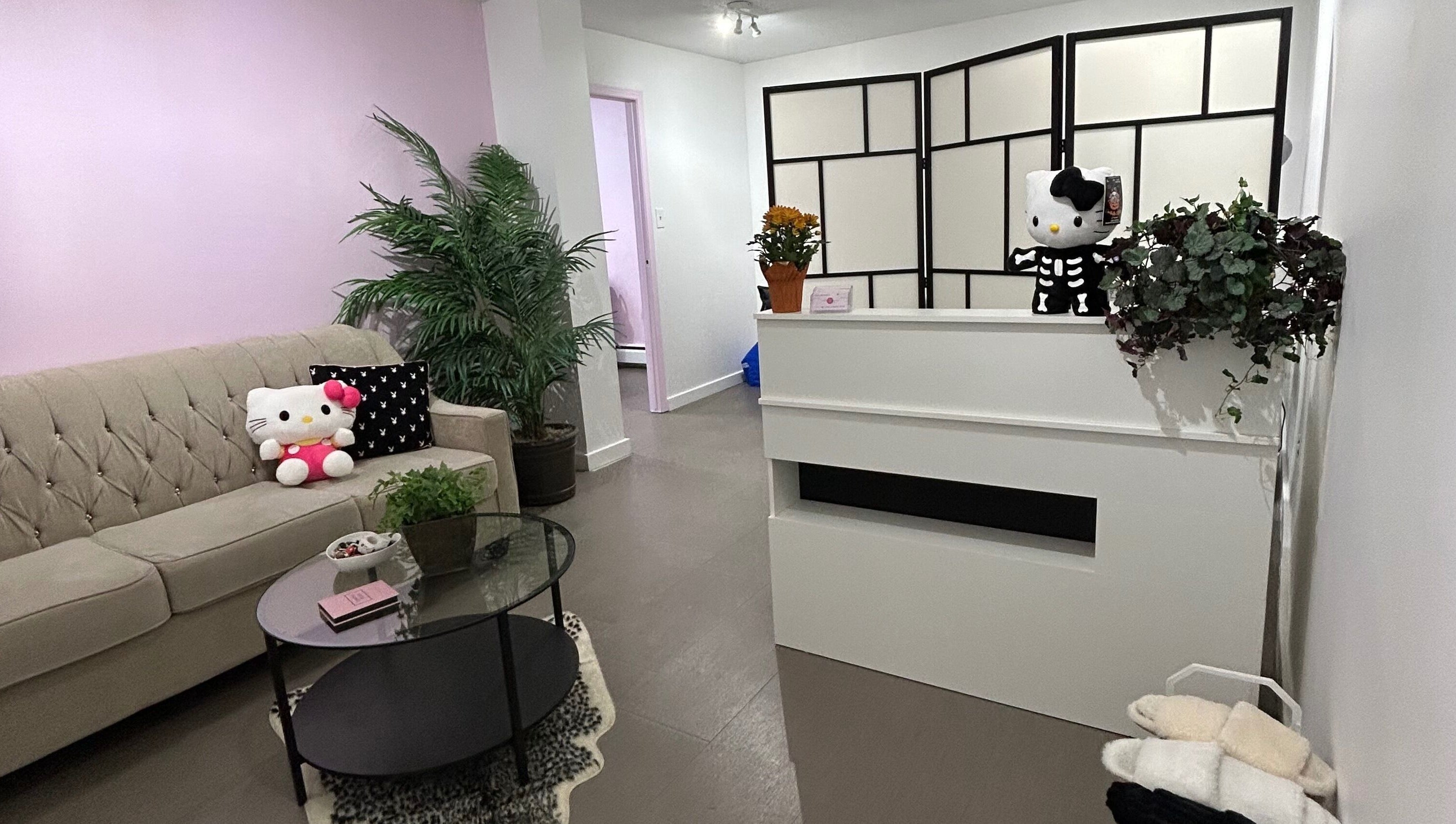 Inviting and cozy lobby at Lashes by Rina in Calgary, Alberta, CA with plush seating and charming decor.