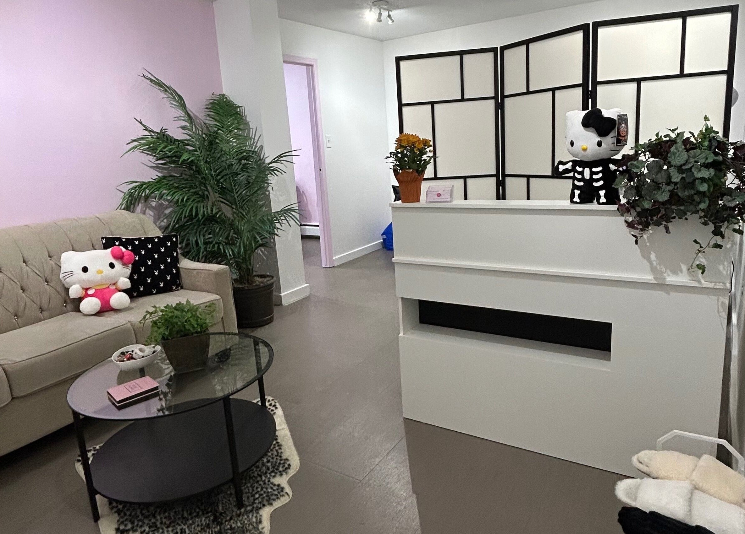 Inviting and cozy lobby at Lashes by Rina in Calgary, Alberta, CA with plush seating and charming decor.