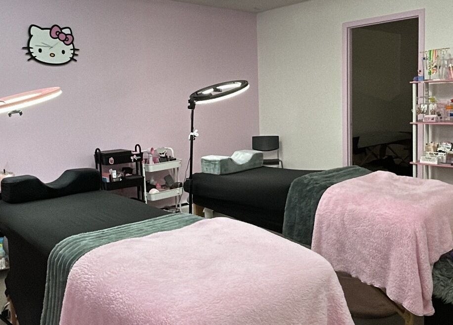 Inviting treatment room at Lashes by Rina, Calgary, Alberta, CA with plush beds and soft lighting.
