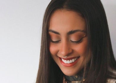 Woman with a radiant smile at Rafaela Pádua Beauty, Burleigh Heads, Queensland, AU.