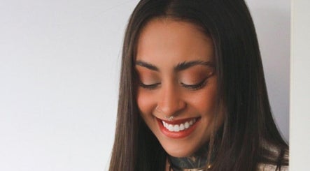 Woman with a radiant smile at Rafaela Pádua Beauty, Burleigh Heads, Queensland, AU.