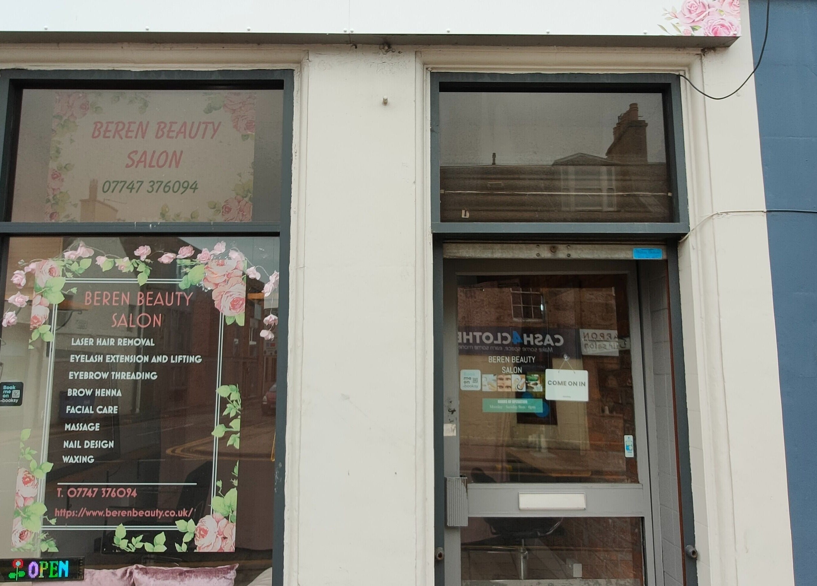Elegant exterior of Beren Beauty Salon in Edinburgh, Scotland, GB showcasing vibrant signage and floral decor.