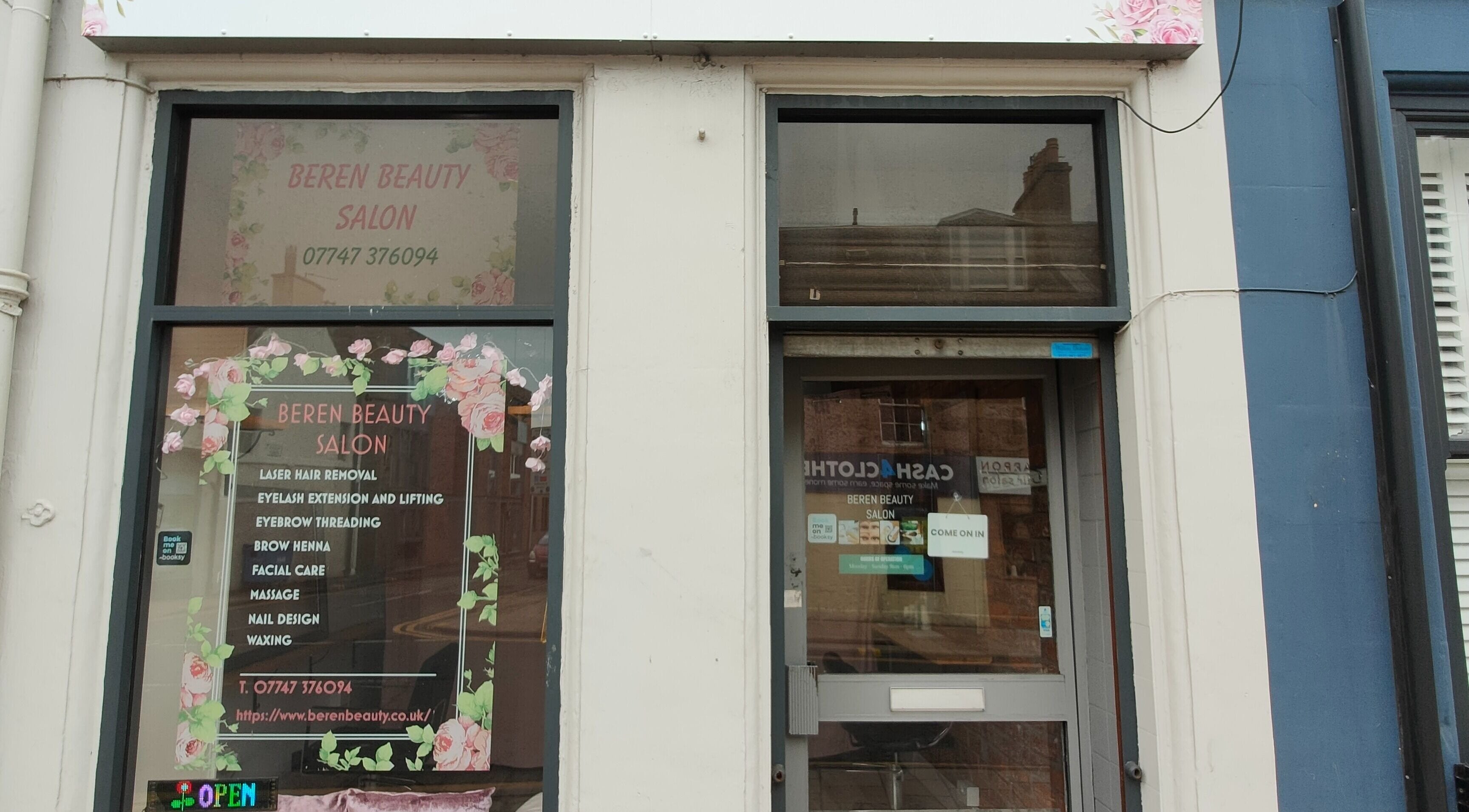 Elegant exterior of Beren Beauty Salon in Edinburgh, Scotland, GB showcasing vibrant signage and floral decor.