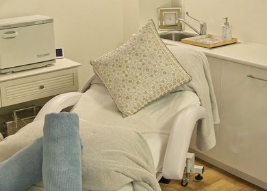 Cozy beauty treatment room at AskinCo, Mooloolaba, Queensland, AU with plush towels and elegant decor.