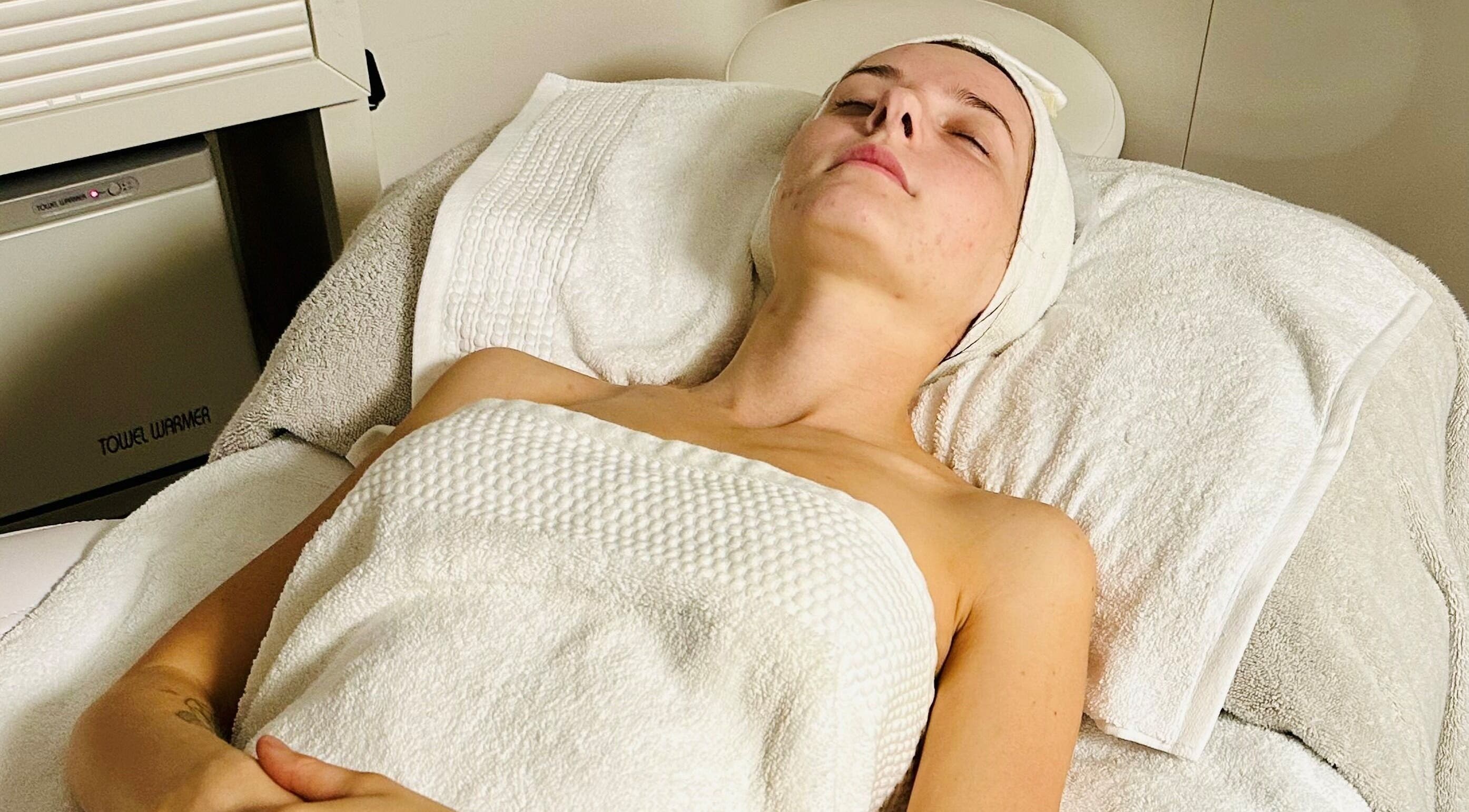 A client enjoys a relaxing facial treatment at AskinCo, Mooloolaba, Queensland, AU.