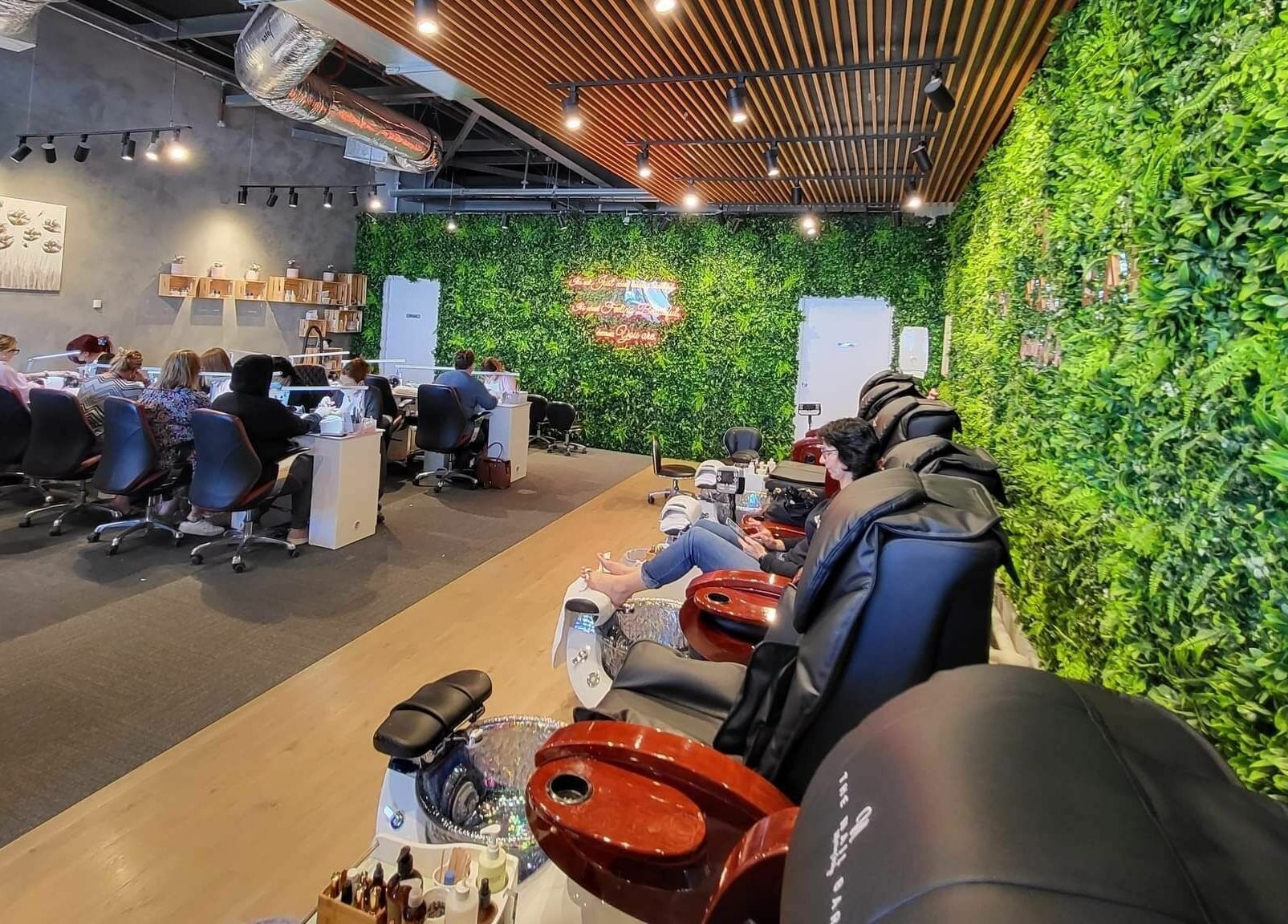 Relaxing interior of The Nail Bar Murray Bridge, with lush greenery walls, located in Murray Bridge, South Australia, AU.