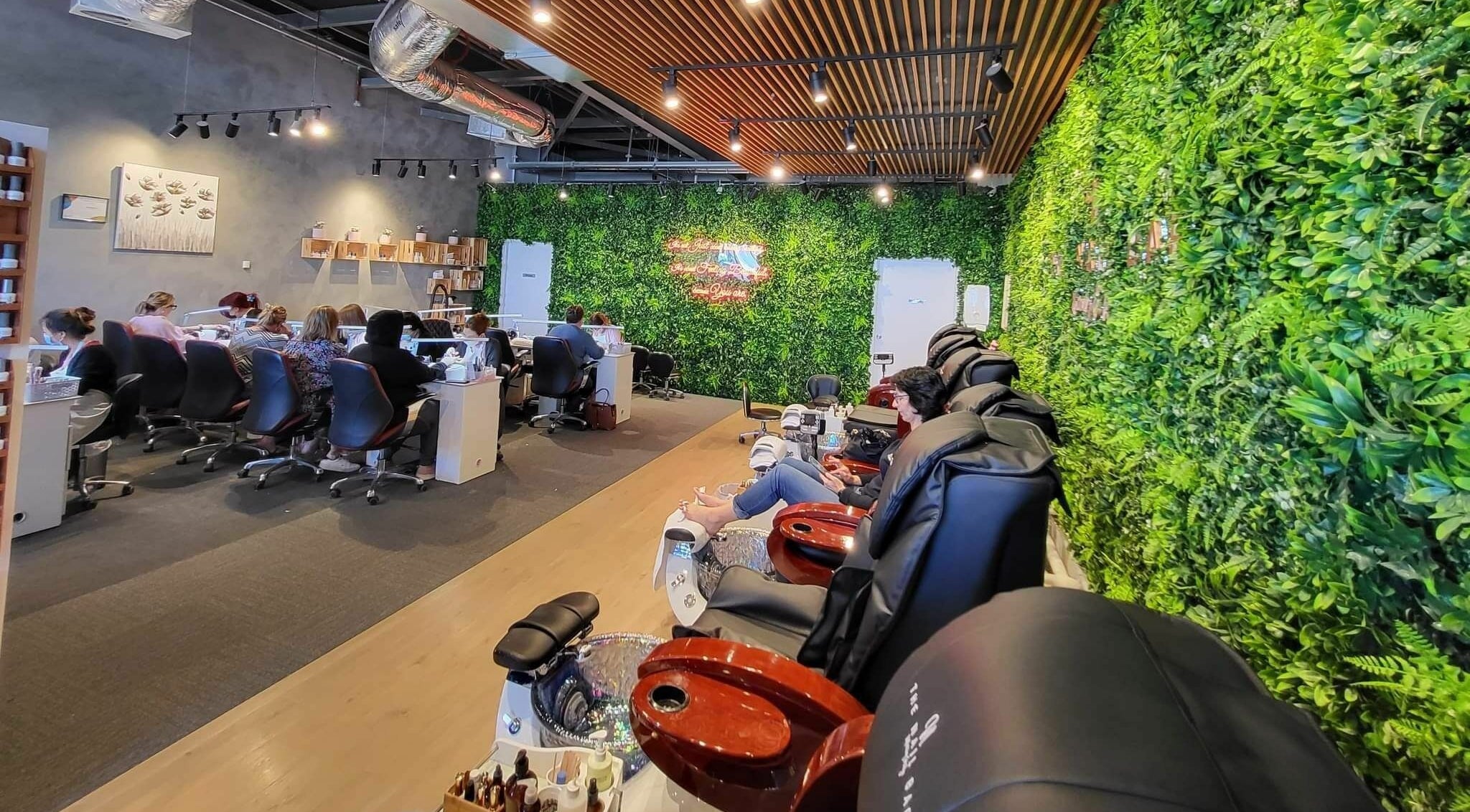 Relaxing interior of The Nail Bar Murray Bridge, with lush greenery walls, located in Murray Bridge, South Australia, AU.
