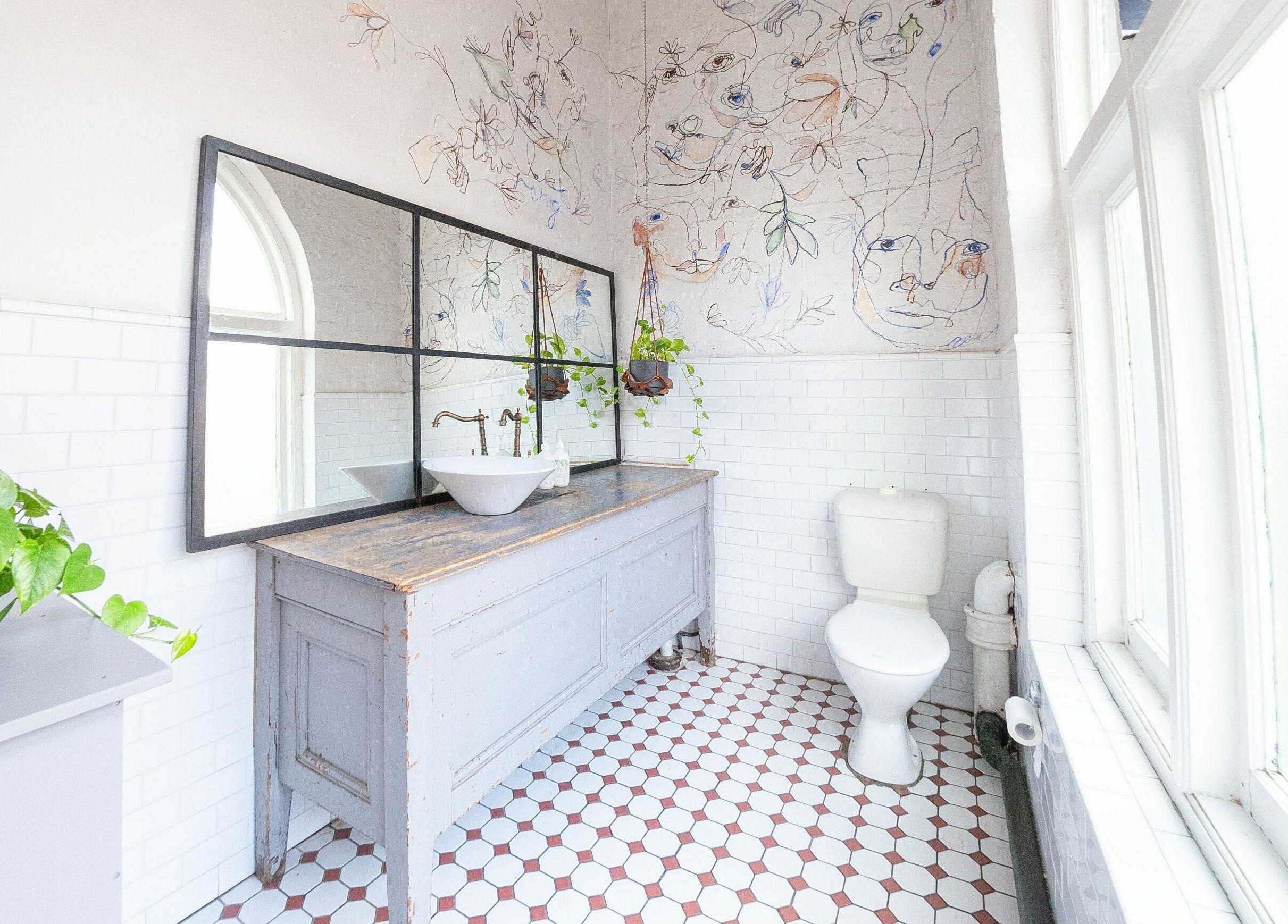 Beautifully designed bathroom with plants and artistic decor at E+Co - Kippax Street, Surry Hills, New South Wales, AU.