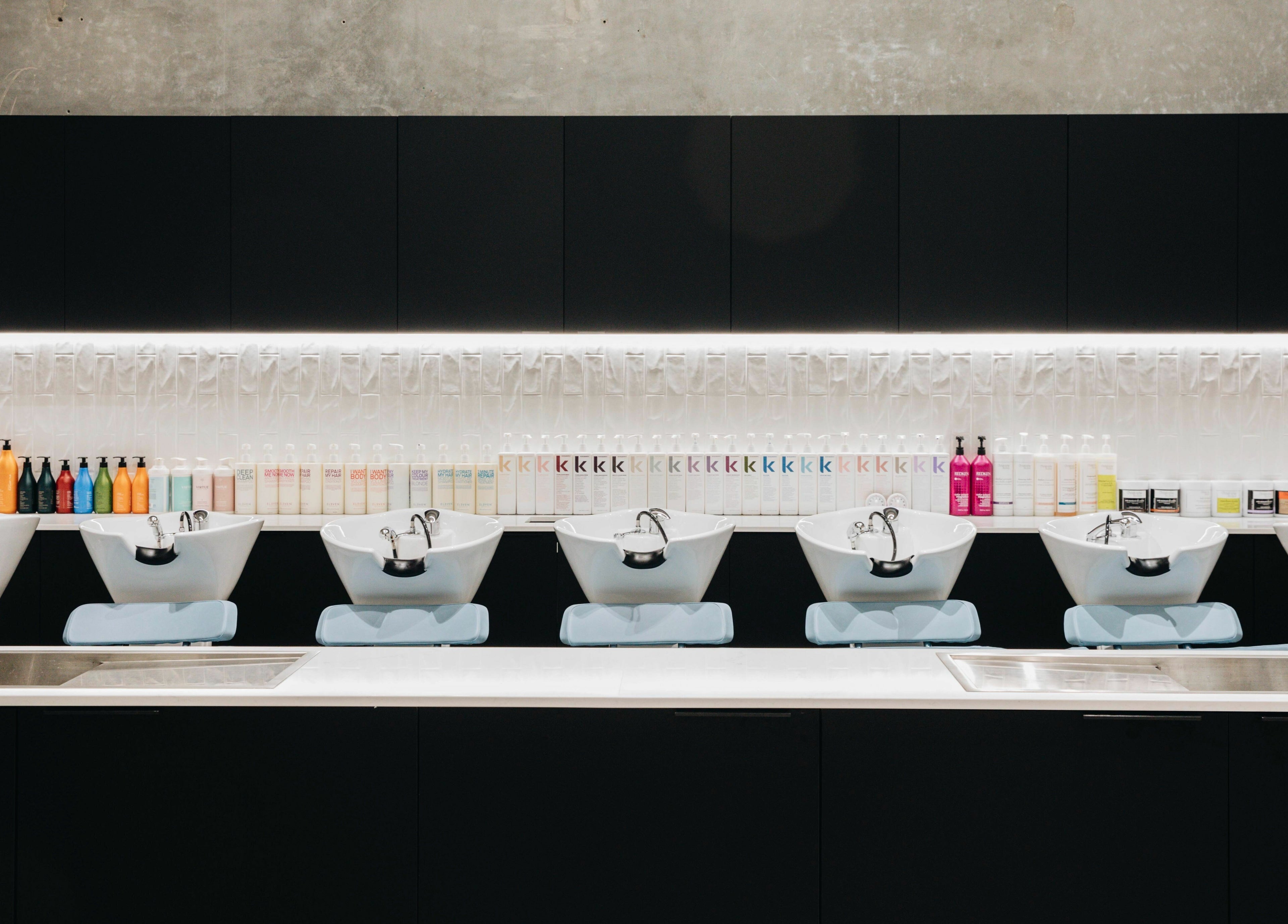 Elegant wash station with colorful product display at E+Co - Fortitude Valley, Queensland, AU.