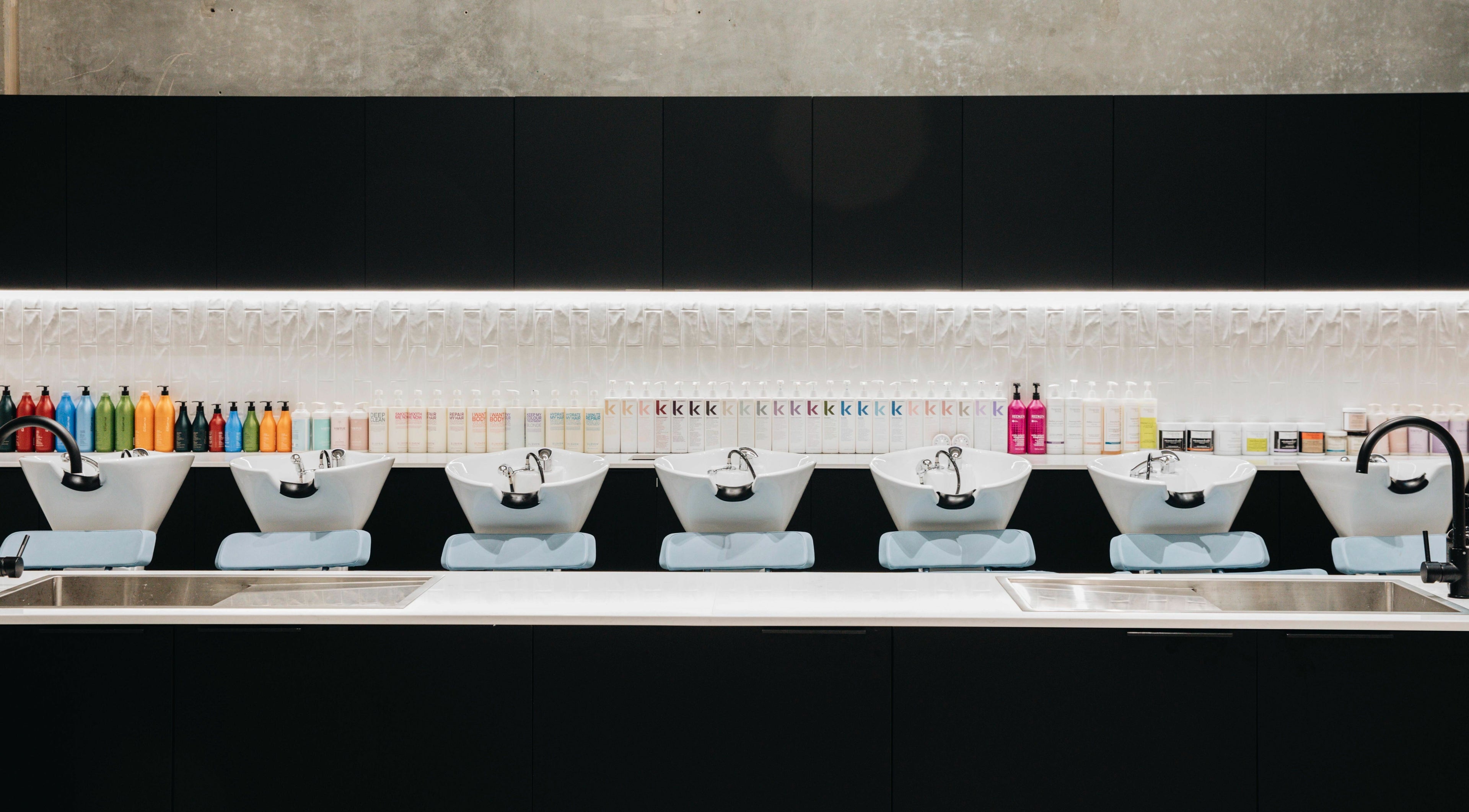 Elegant wash station with colorful product display at E+Co - Fortitude Valley, Queensland, AU.