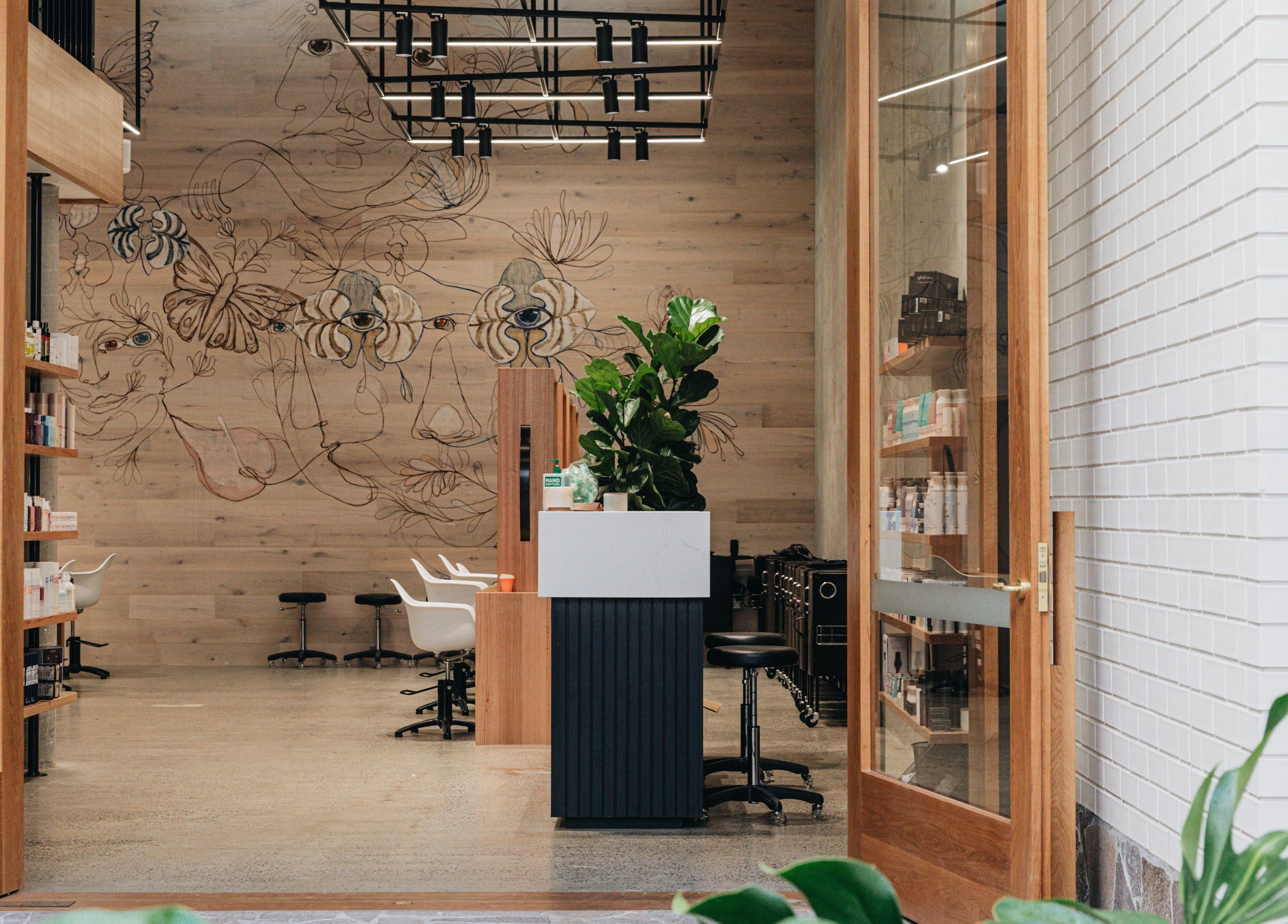 Inviting entrance of E+Co - Fortitude Valley in Fortitude Valley, Queensland, AU, showcasing stylish salon decor.