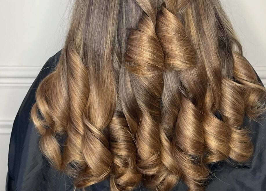 Elegant curled hairstyle at The Blowdry Bar and Training Academy, Torquay, England, GB.